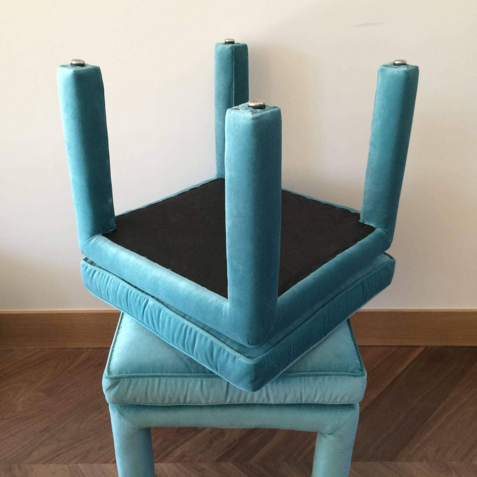 A beautiful pair of newly upholstered Parsons stools in aqua colored velvet.