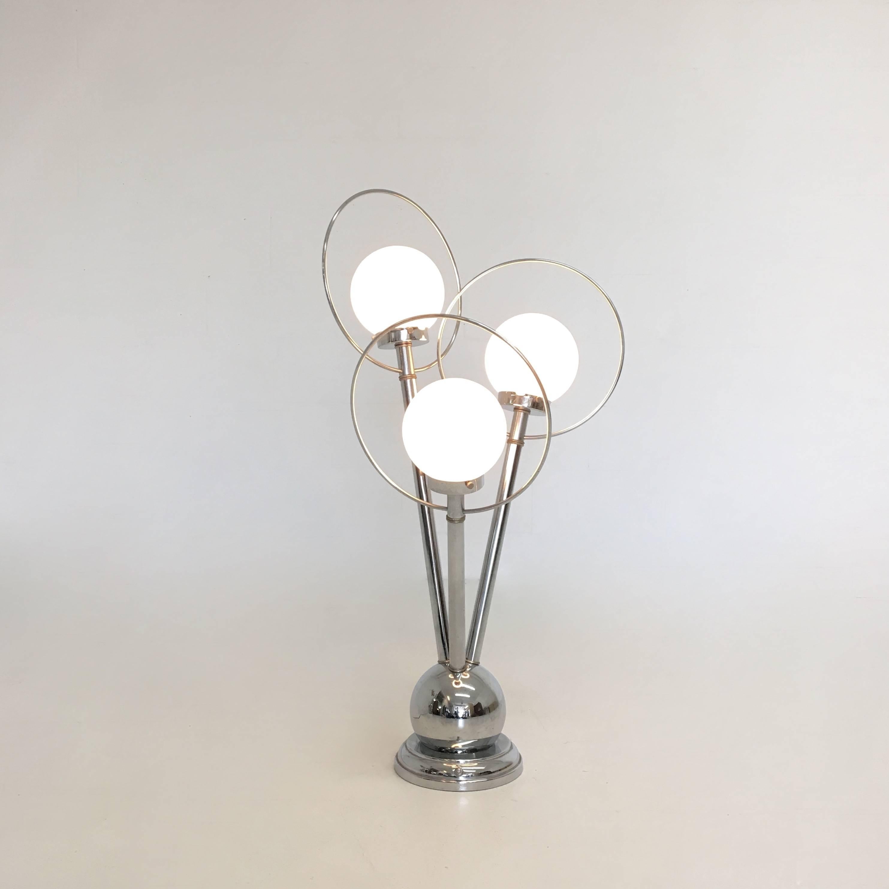 Sonneman three-bulbed table lamp in chrome and glass. Option of one, two or three bulbs on. Some age appropriate wear.
8