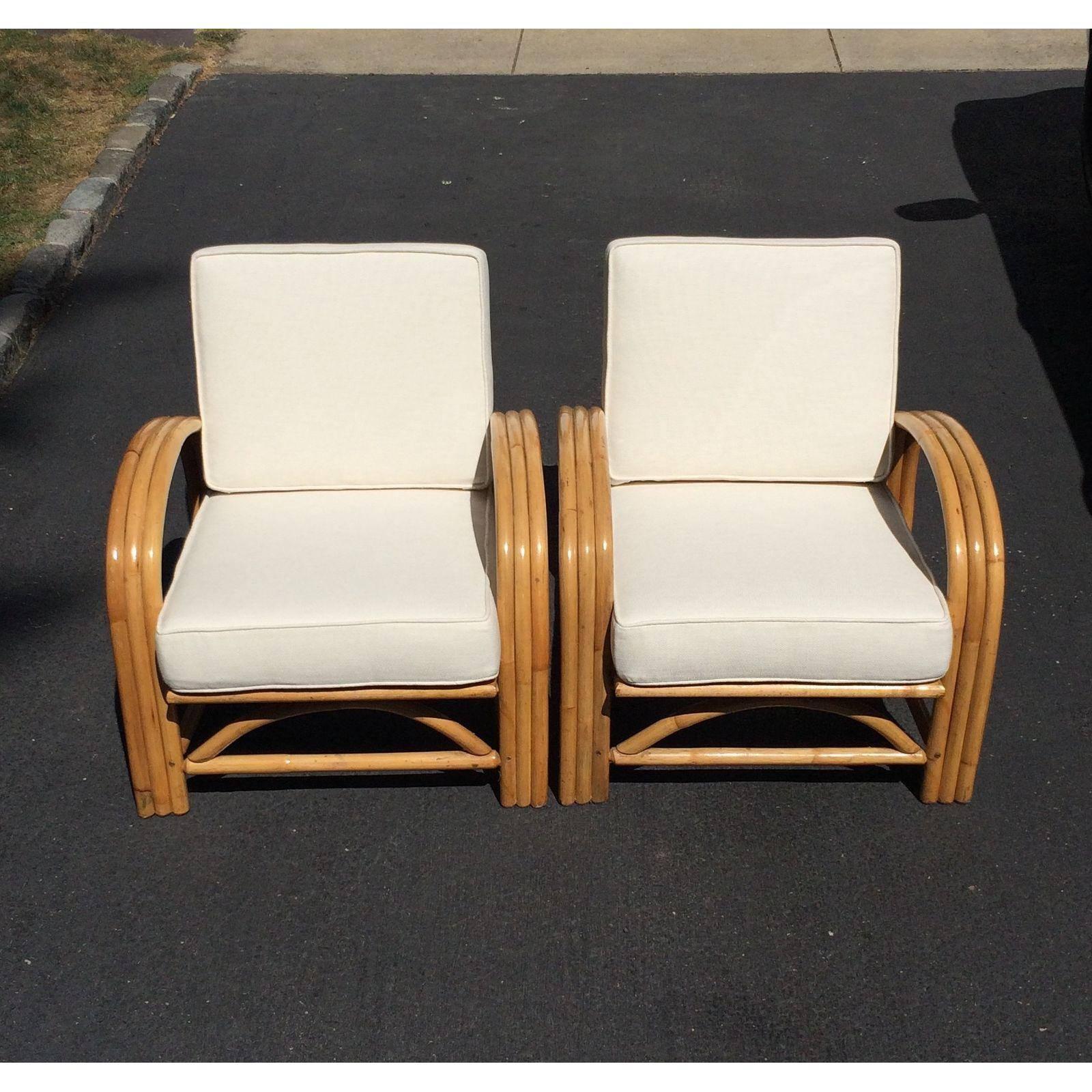A pair of Mid-Century bamboo club chairs with newly upholstered cushions ready for your home!
Seat height is 16 1/2 