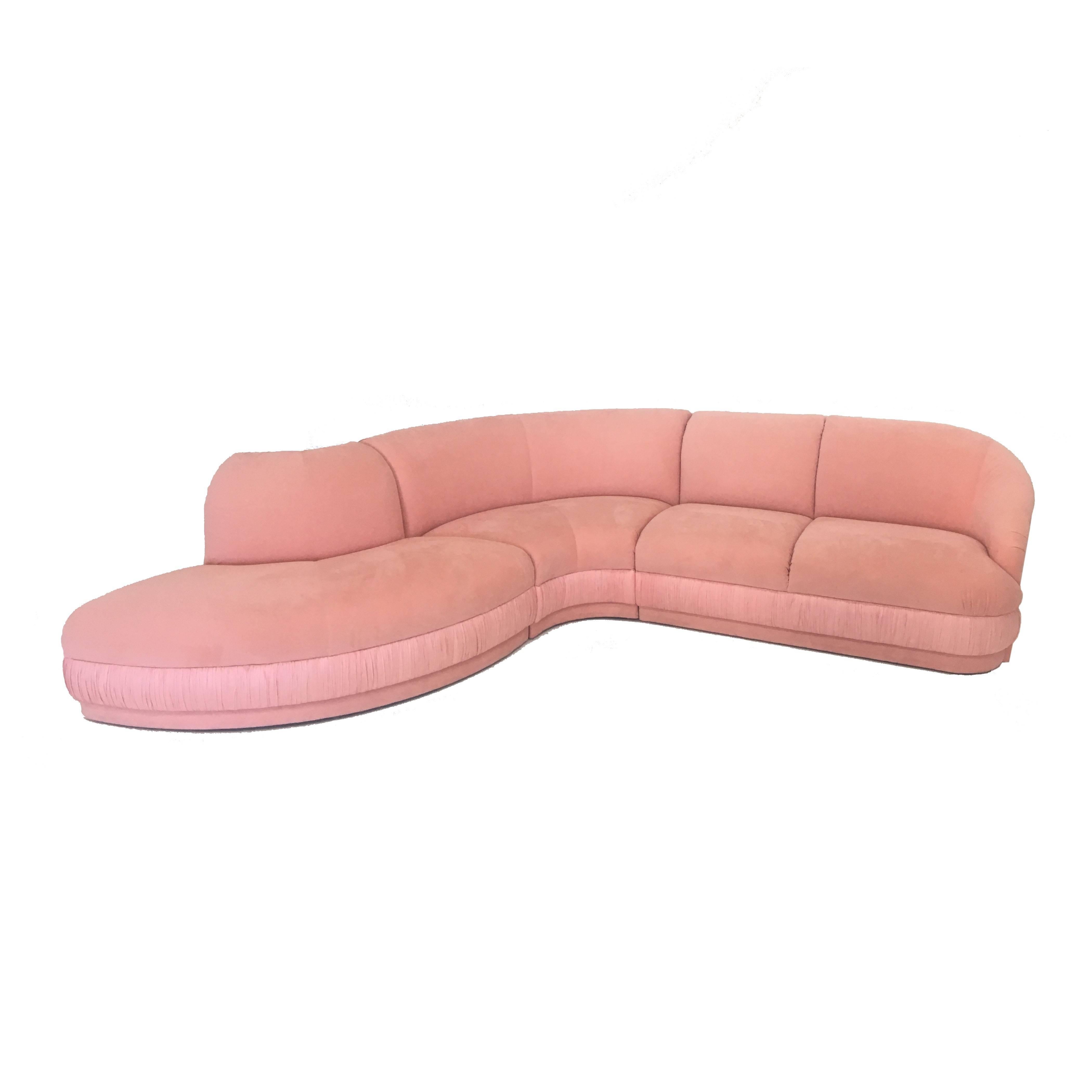 Fabulous three-piece sectional sofa designed by Vladimir Kagan for Weiman Company. Soft pink ultra suede, sofa can be arranged in two different configurations. Interlocking system underneath which holds the sections together. Some light staining and