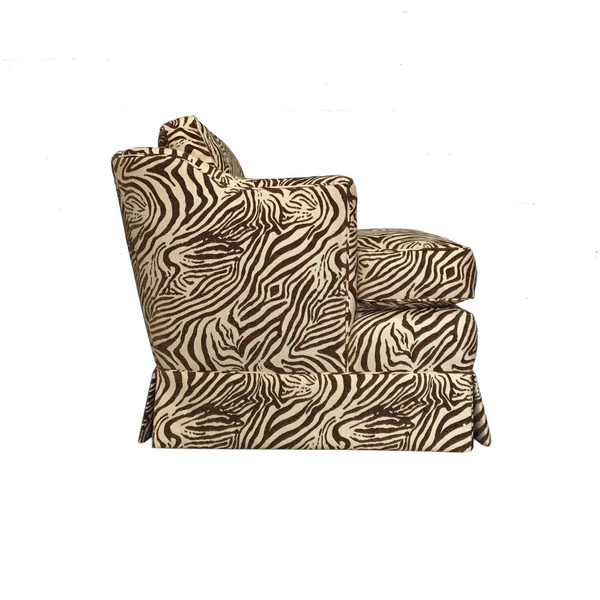 A wonderful pair of lounge chairs in a brown and cream zebra print. They have a wonderful size and line to the back and arm and are amazingly comfortable!