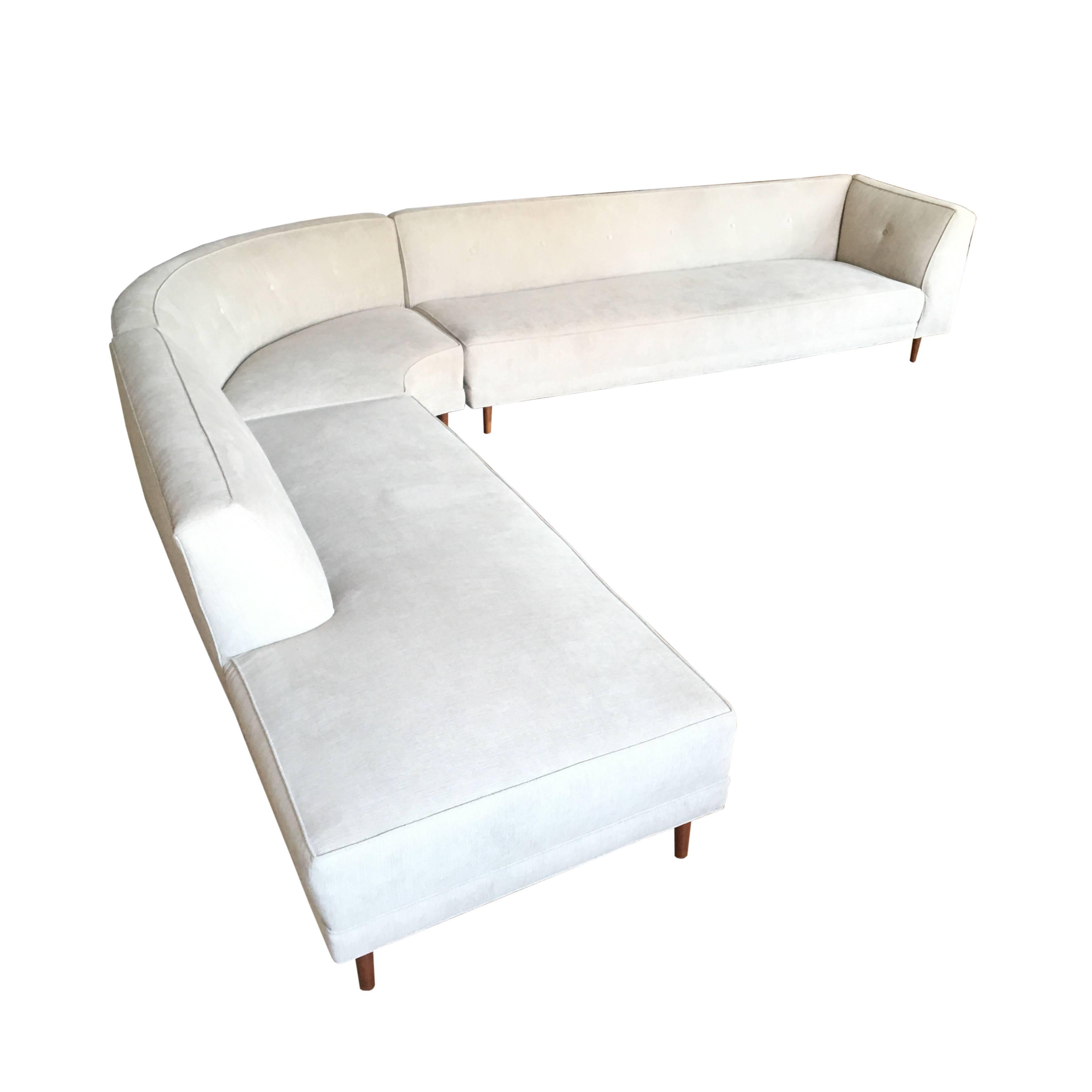 Oversized three-piece Mid-Century Modern sectional sofa. Newly reupholstered in fleck grey Crypton stain resistant fabric.
 
Measurements:
Long section: 90