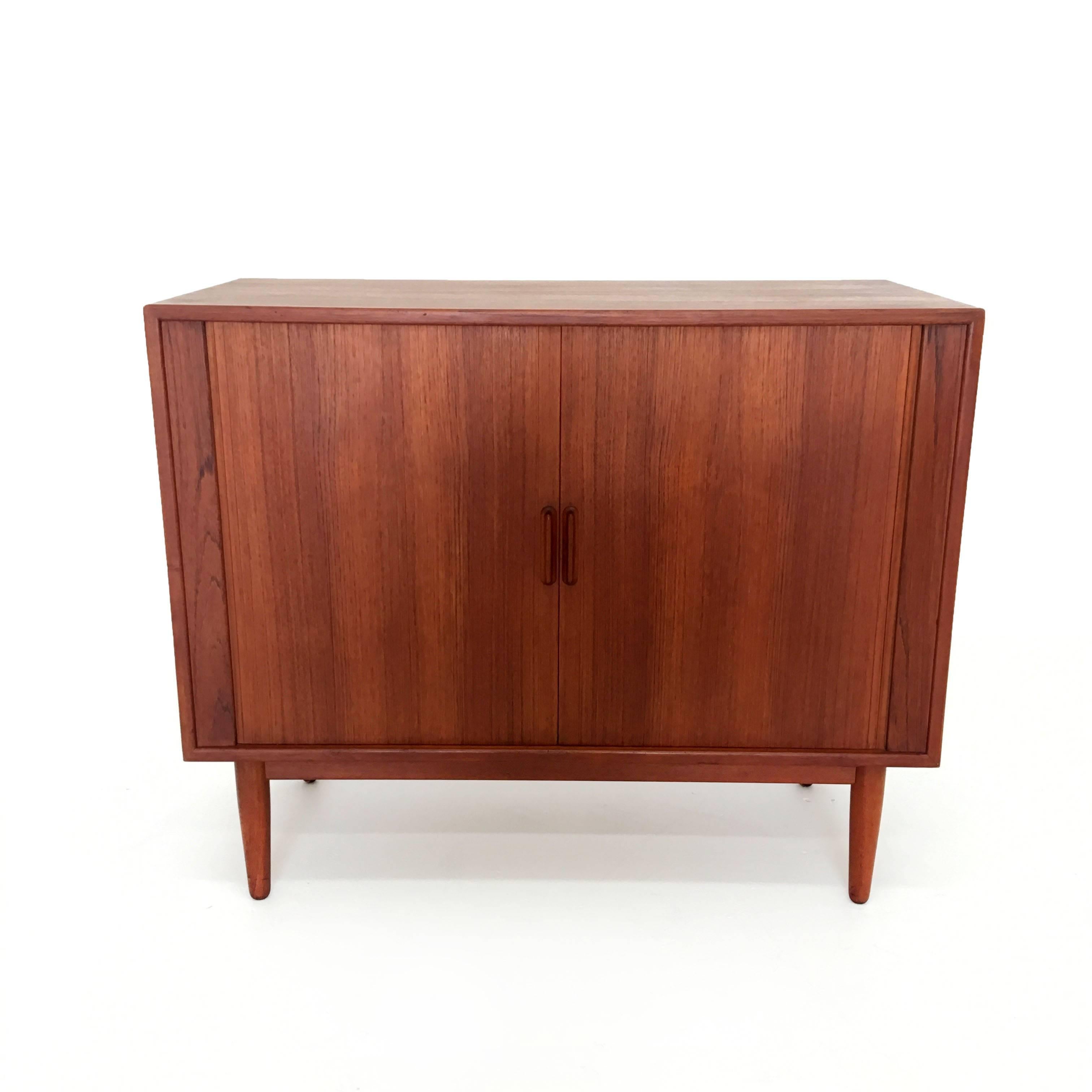 Danish modern bar cabinet with sliding tambour doors. 
Great condition with minimal age appropriate wear.