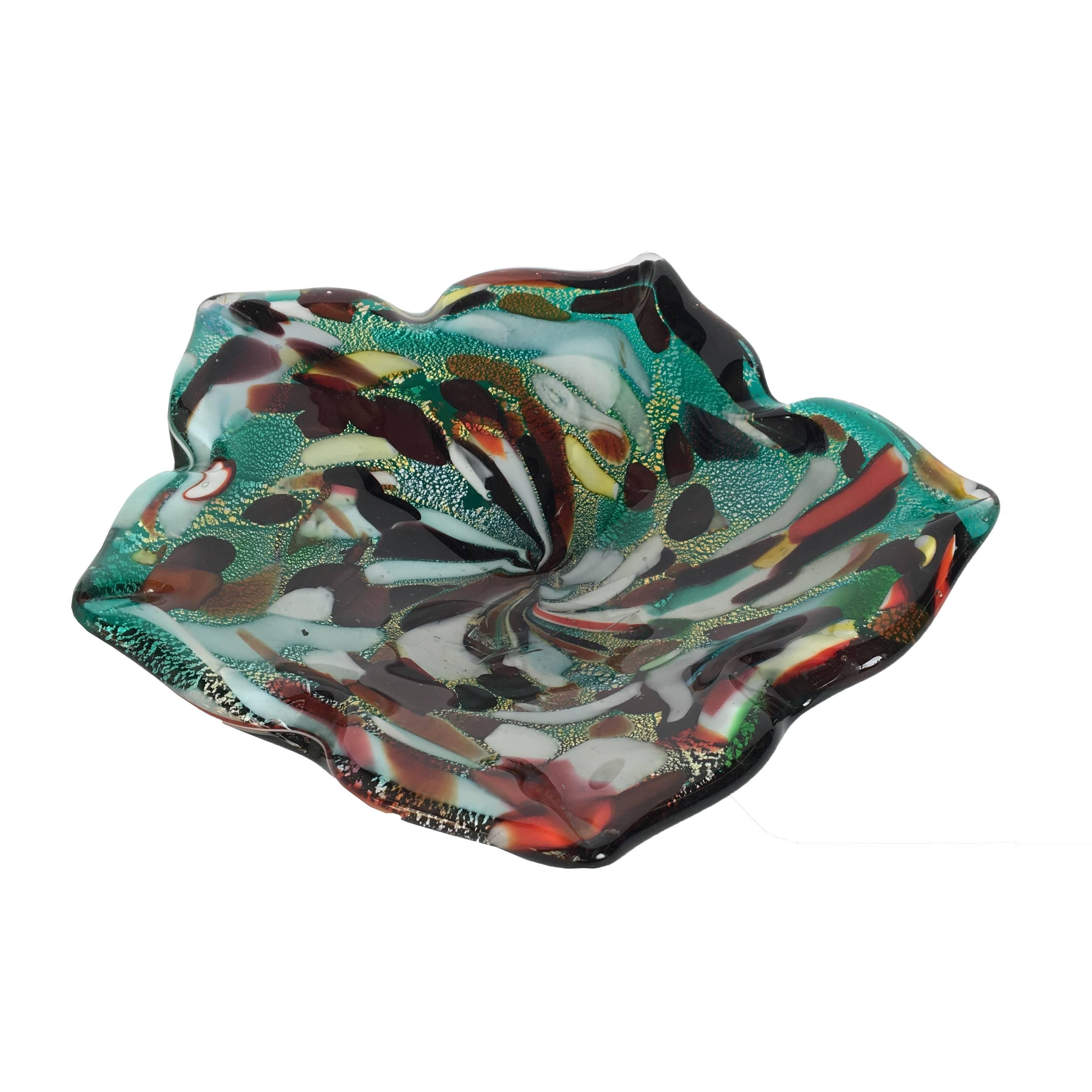Mid-Century Murano art glass bowl with multiple colors and gold flake throughout. Minor imperfection in glass.