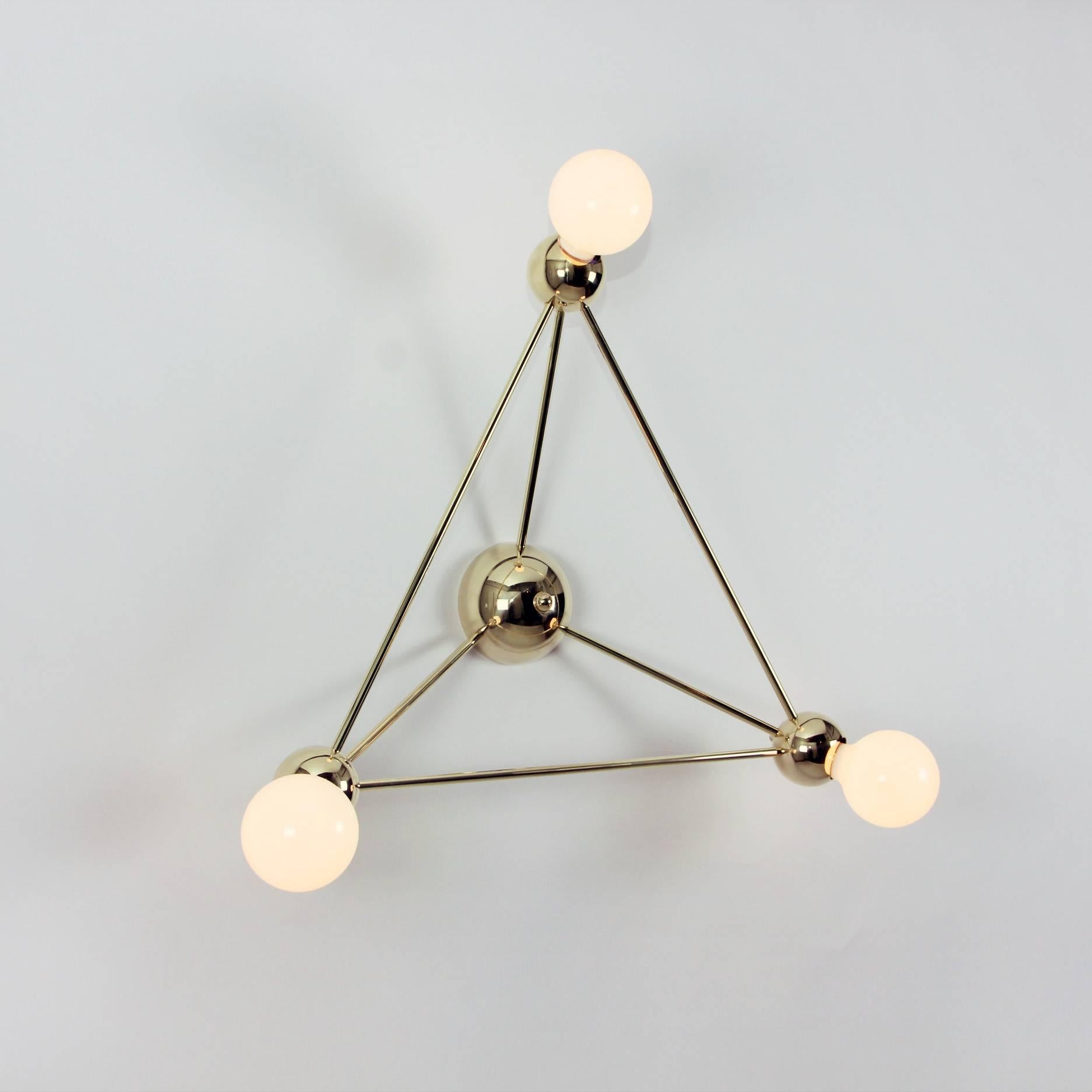 Inspired by 1960s Italian lighting, Lina is an all-brass lighting system designed to create airy geometric fixtures.
Each welded brass sphere joins with solid brass tubing and minimal fastener hardware to form strikingly simple hanging and