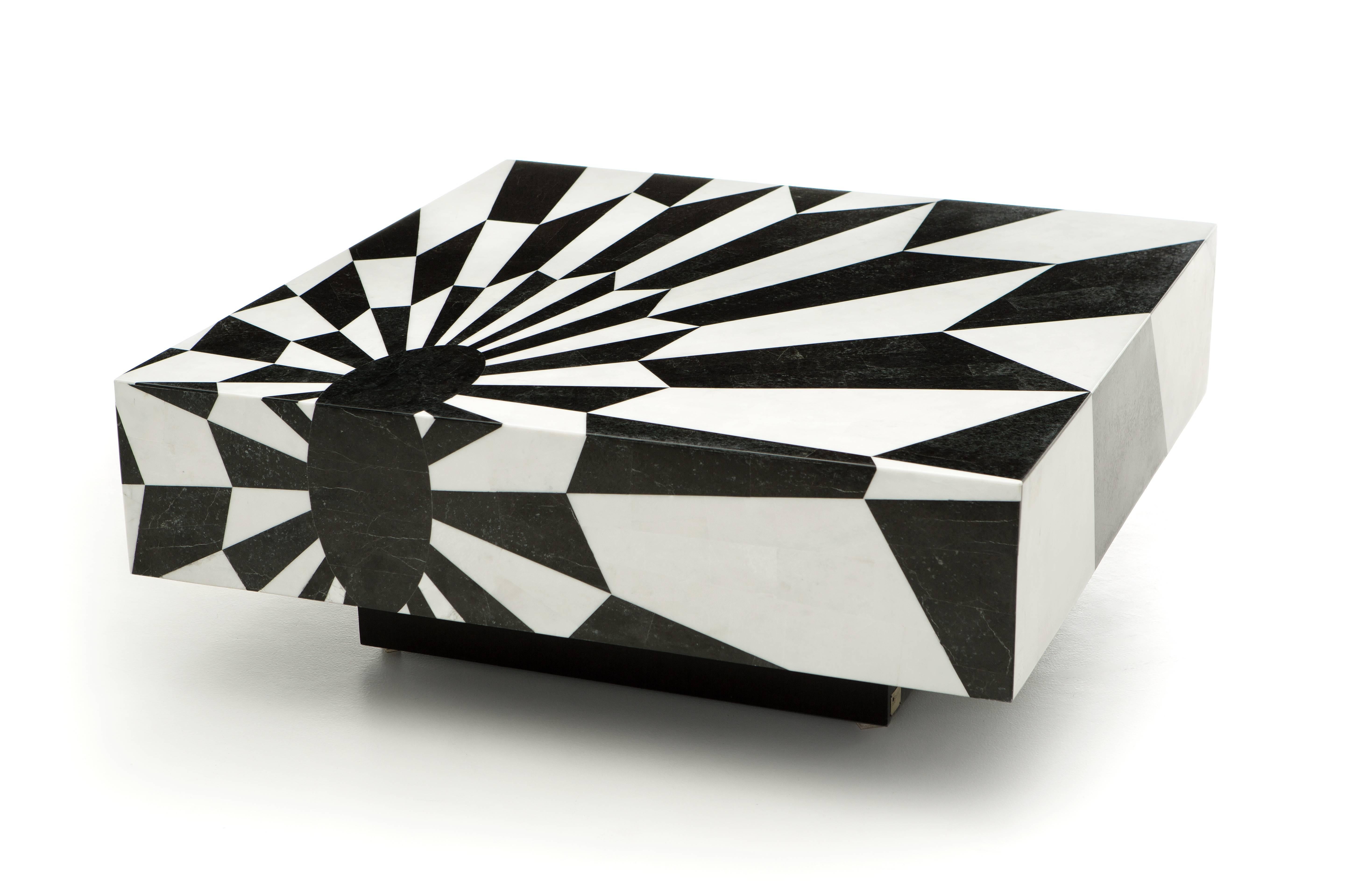 This striking coffee table, part of the ‘Rive Gauche’ collection is covered in magnificent black and white marble marquetry geometric pattern. This noble technique consists of hand-cutting of perfectly shaped fine pieces of marble and inlaying them