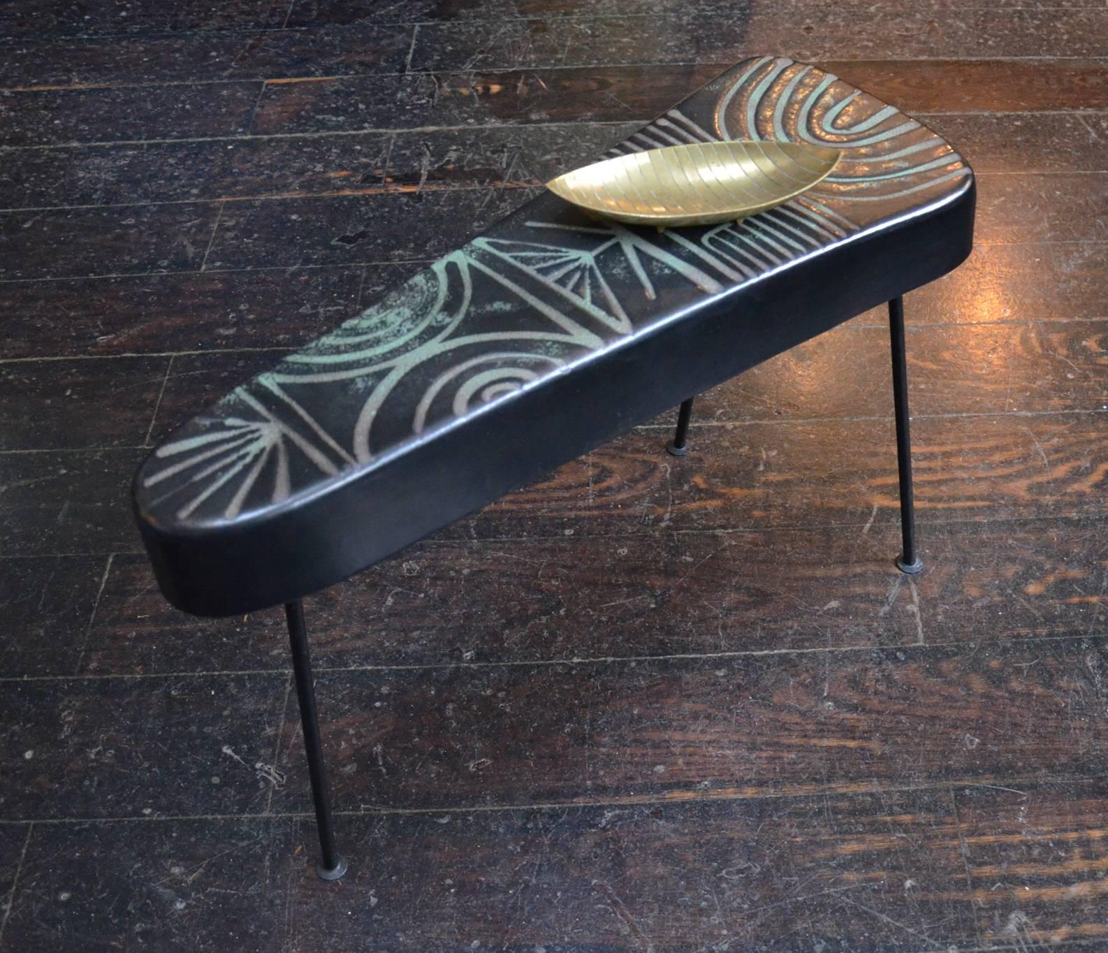 Exquisite ceramic side table by Roger Capron (1920-2006).
This side table could be between two armchairs or on the side or in front of a sofa. 
It is a sculptural art piece.
The pattern on the ceramic top is quite rare in the work of Roger Capron