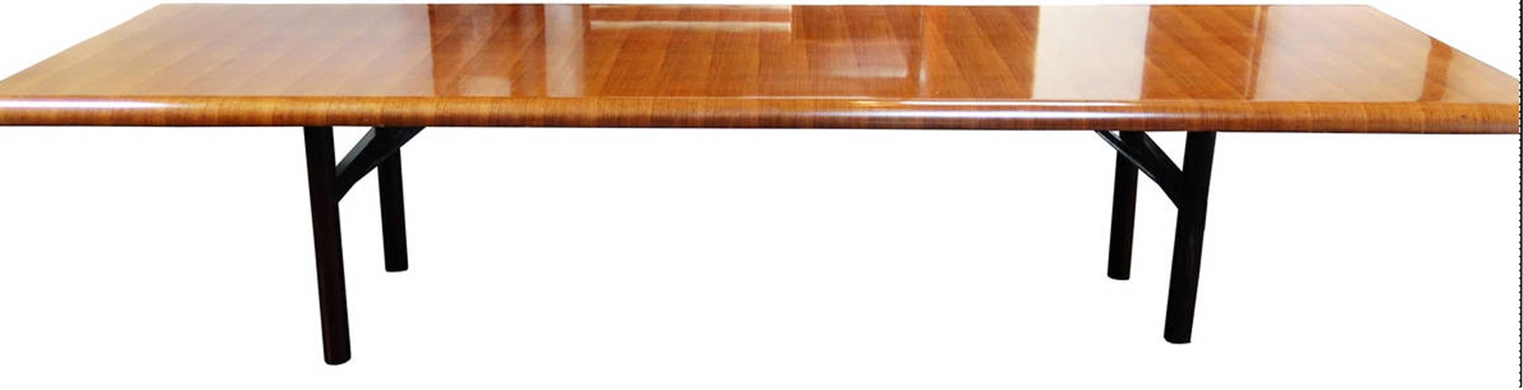 This exceptional oversized dining table has a perfect and fluid design with amazing airplane wing movement at its edges and a fabulous striped walnut wood, with a beautiful and sober structured steel base.
This Unique piece is handsome with a lot