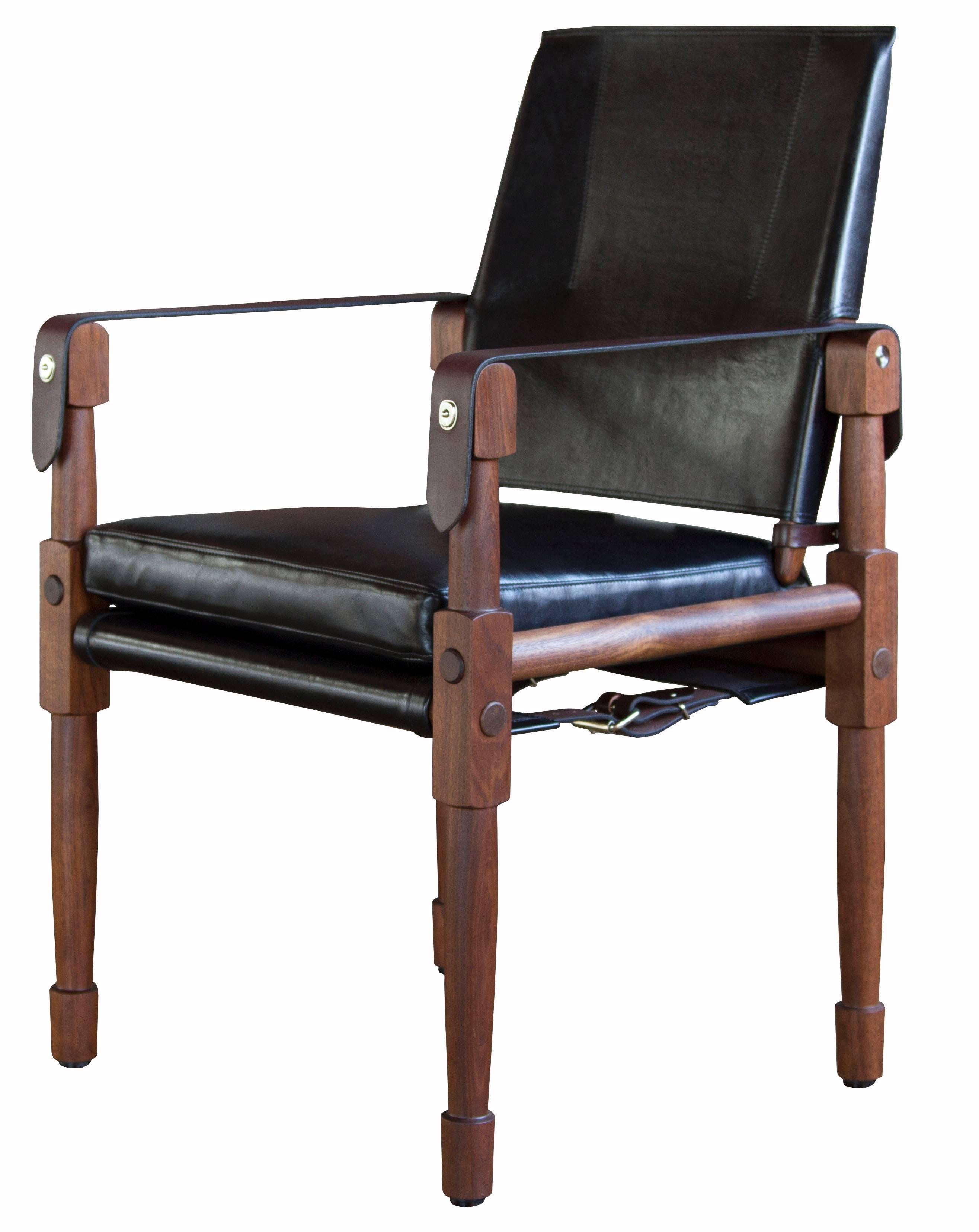 A Chatwin dining chair in oiled walnut with Moore & Giles: Notting Hill / Black and Havana English bridle leather straps.

The modern campaign collection by Richard Wrightman combines the vernacular of traditional form with a modern aesthetic,