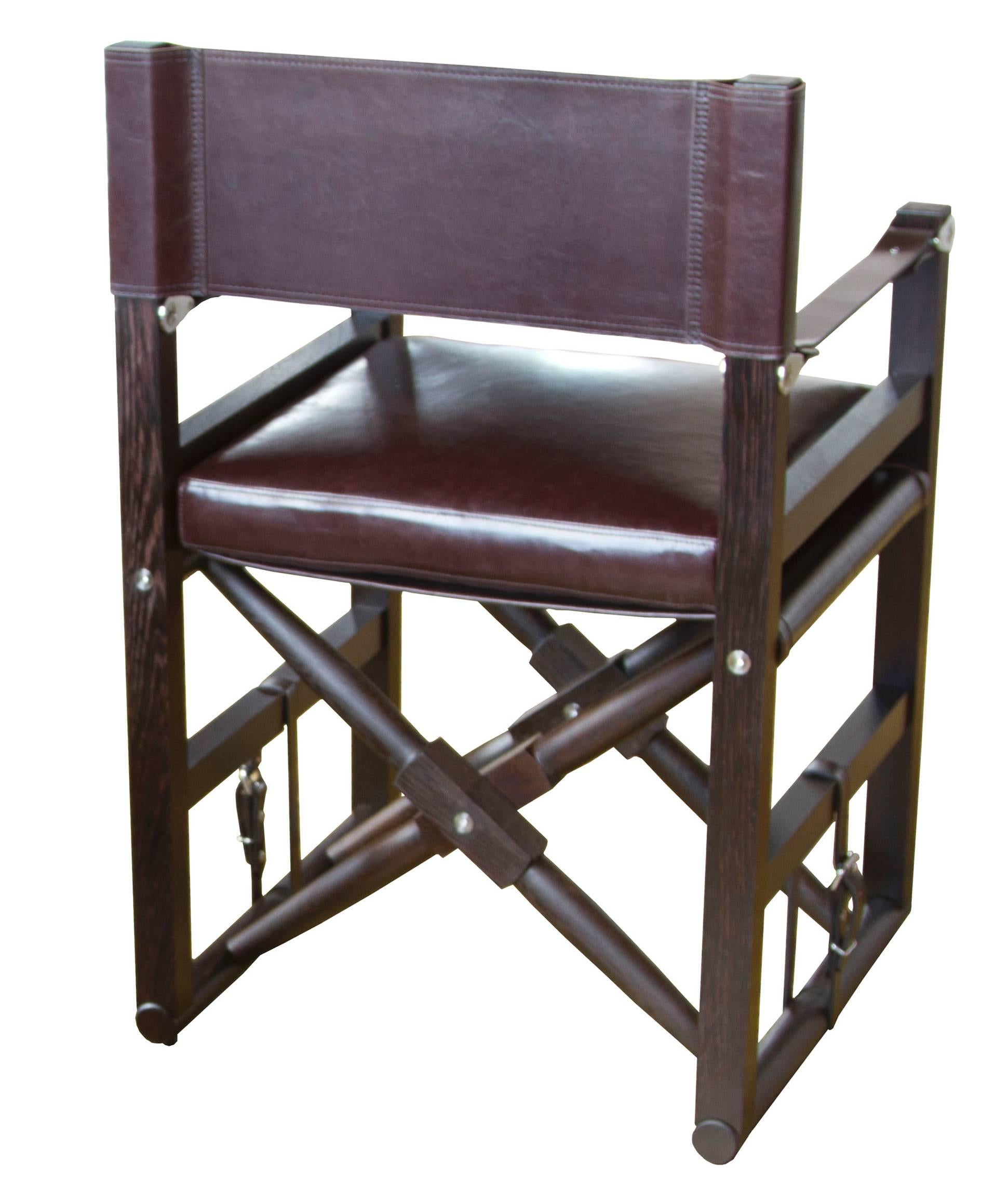 The Cabourn folding chair in oiled wenge with Moore & Giles: Diablo / Espresso upholstery and dark chocolate English bridle leather strapping.

The modern campaign collection by Richard Wrightman combines the vernacular of traditional form with a