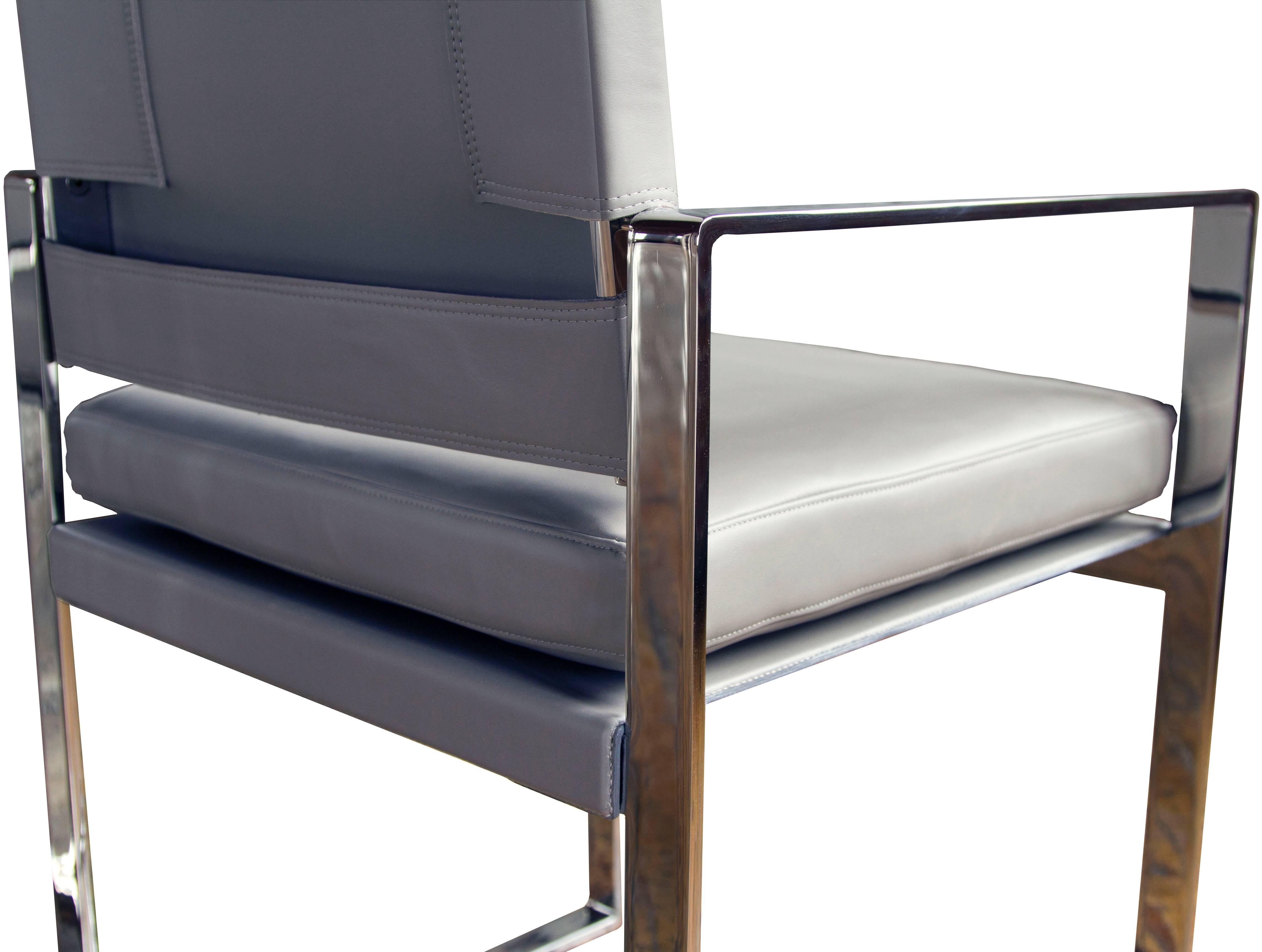 The St. Cloud dining chair in polished stainless steel and Garrett: Flight / Carolina Gull leather upholstery.

The modern campaign collection by Richard Wrightman combines the vernacular of traditional form with a modern aesthetic, mixing memory