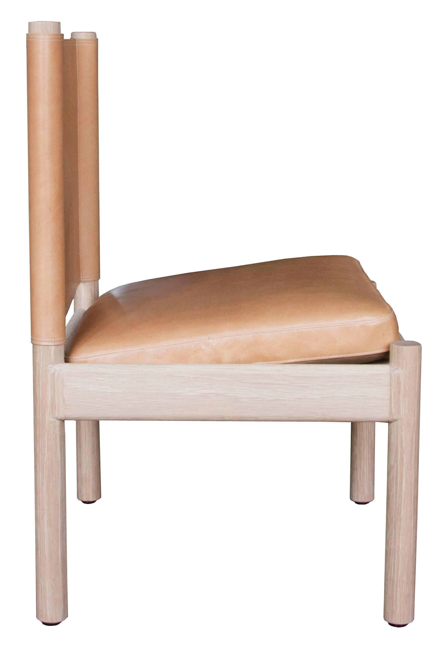 The Reed lounge chair in natural finished white oak with Moore & Giles: Diablo / Cane leather upholstery

The modern campaign collection by Richard Wrightman combines the vernacular of traditional form with a modern aesthetic, mixing memory with