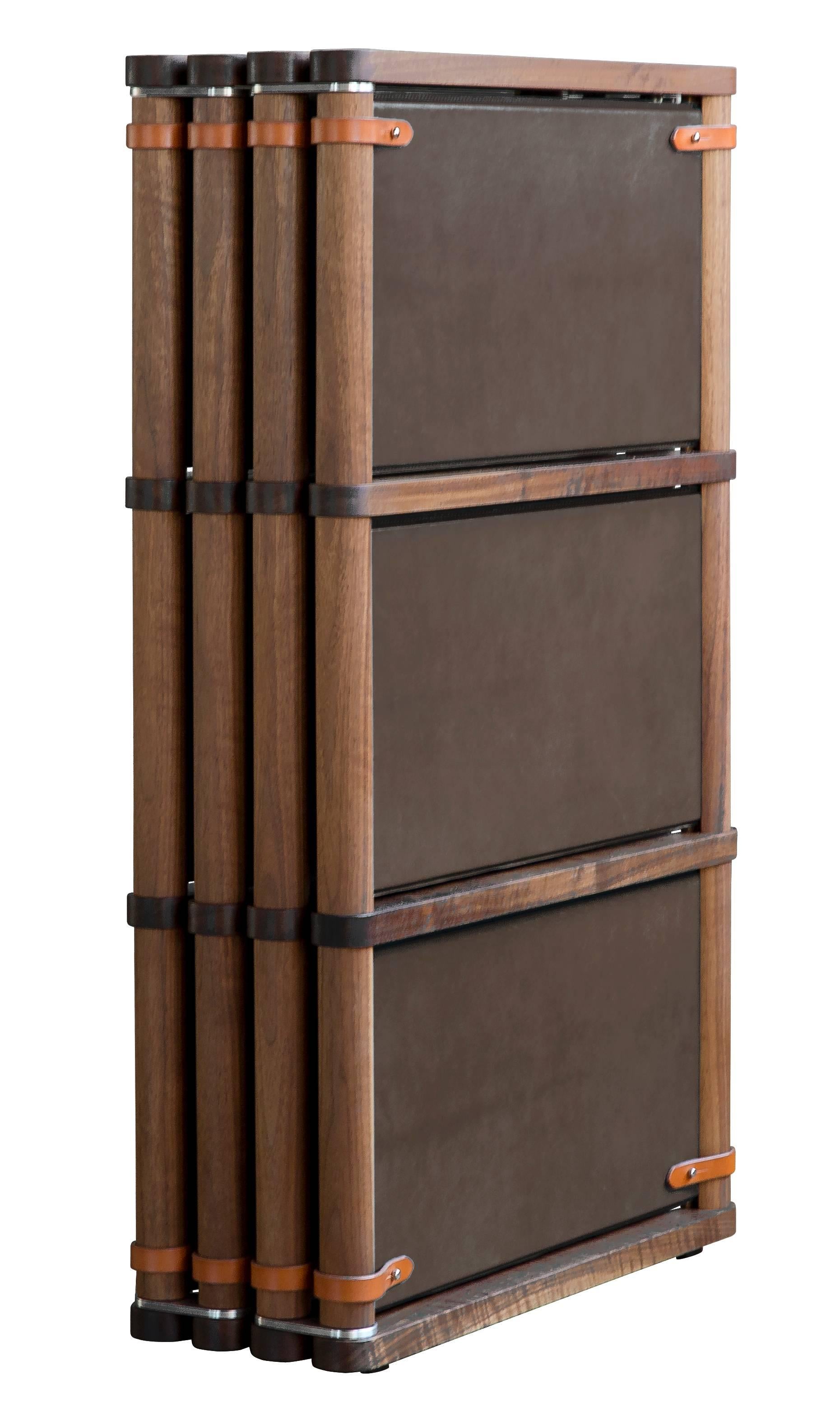 The Lambert folding screen or room divider- type 2 in oiled walnut with Moore & Giles: Valhalla / Grove leather panels and cognac English bridle leather strapping.

The lambert folding screen type 2 has aluminum hinges that allow free moment in any