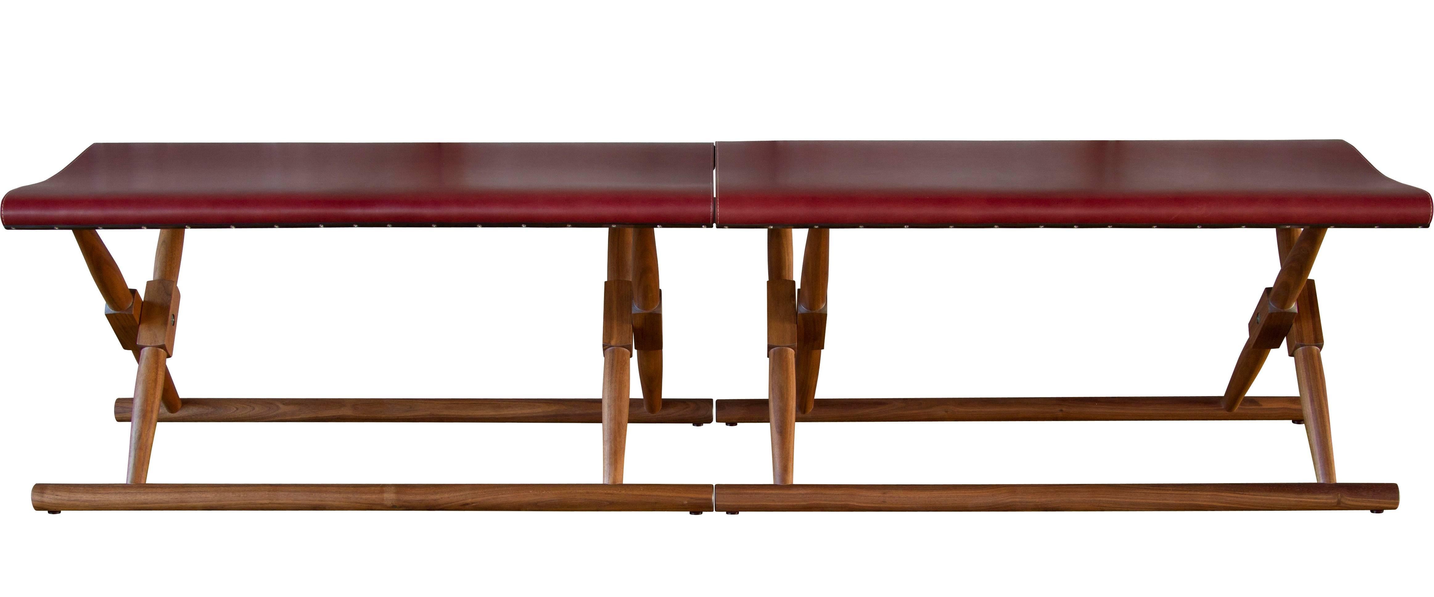 A pair of Matthiessen folding benches in oiled walnut with Moore & Giles: Diablo / Walnut leather seat slings.

The modern campaign collection by Richard Wrightman combines the vernacular of traditional form with a modern aesthetic, mixing memory
