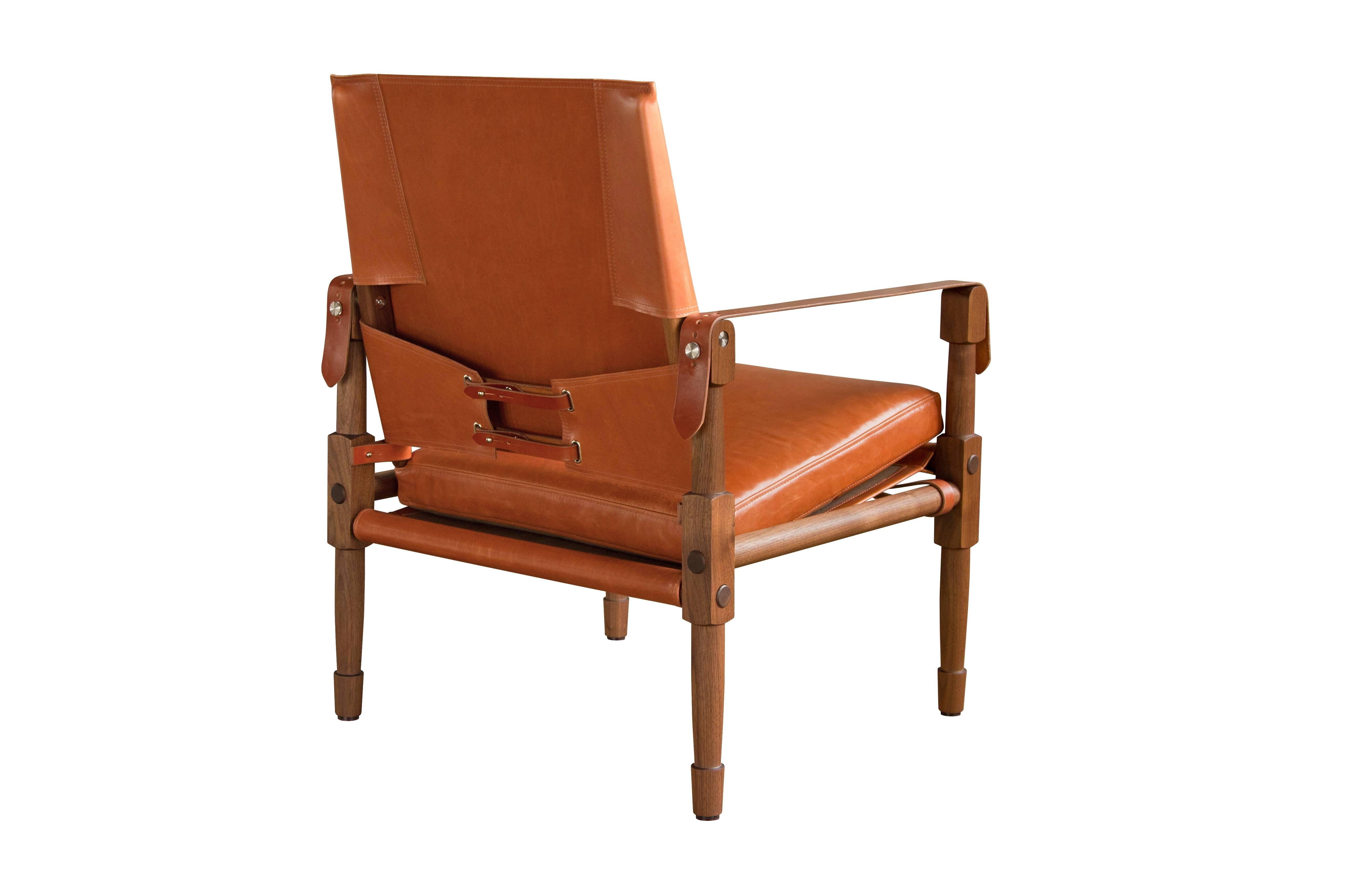 The Grand Chatwin Lounge Chair in oiled walnut with Moore and Giles: Diablo / Acorn leather upholstery and cognac English bridle leather.

The modern campaign collection by Richard Wrightman combines the vernacular of traditional form with a modern