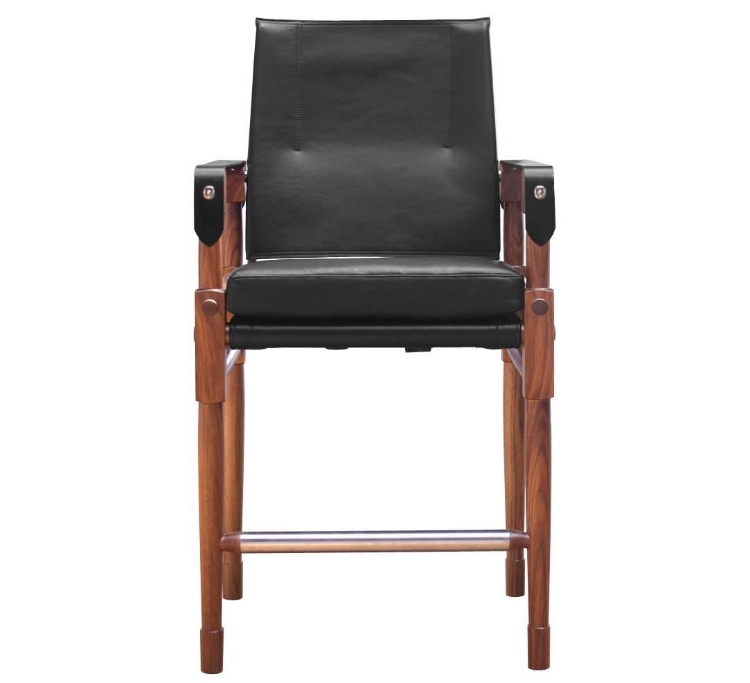 The Chatwin counter chair in oiled walnut with Moore & Giles: Deer Run / Black with black English bridle leather straps.

The modern campaign collection by Richard Wrightman combines the vernacular of traditional form with a modern aesthetic, mixing