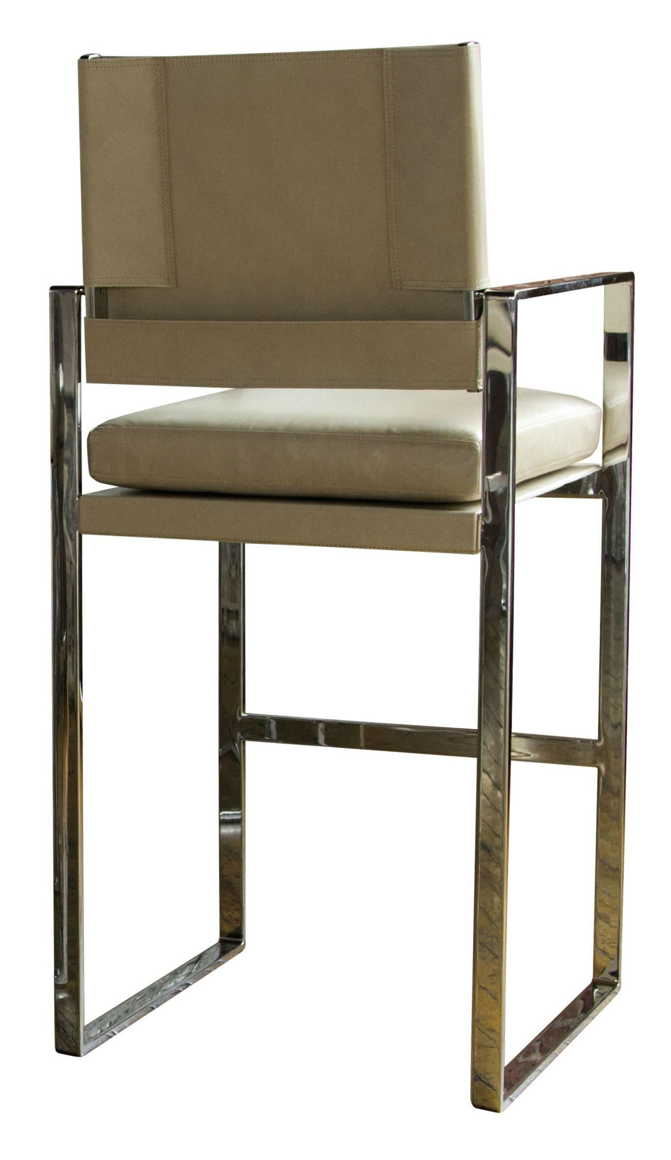 The St. Cloud bar chair in polished steel with Moore & Giles: Notting Hill / Parchment leather upholstery.

The modern campaign collection by Richard Wrightman combines the vernacular of traditional form with a modern aesthetic, mixing memory with