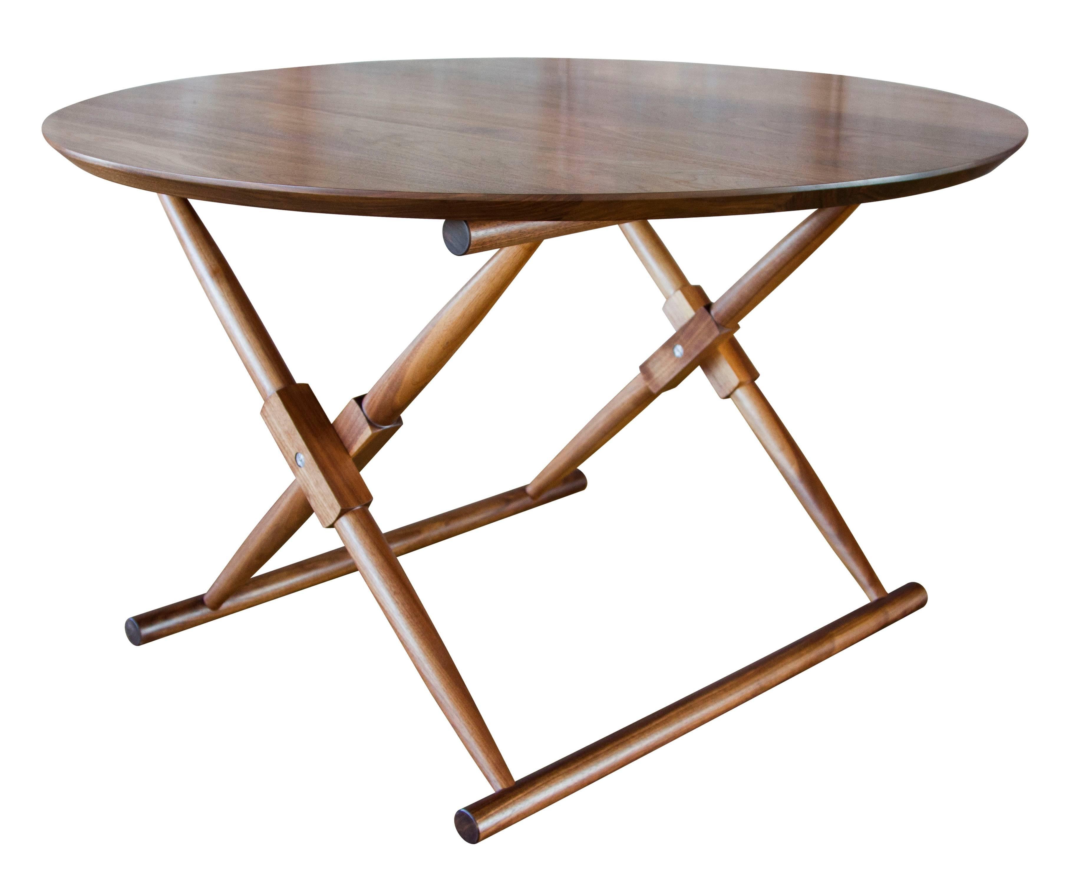 The Matthiessen round dining table in oiled walnut 

The modern campaign collection by Richard Wrightman combines the vernacular of traditional form with a modern aesthetic, mixing memory with invention, creating pieces that subtly reference the