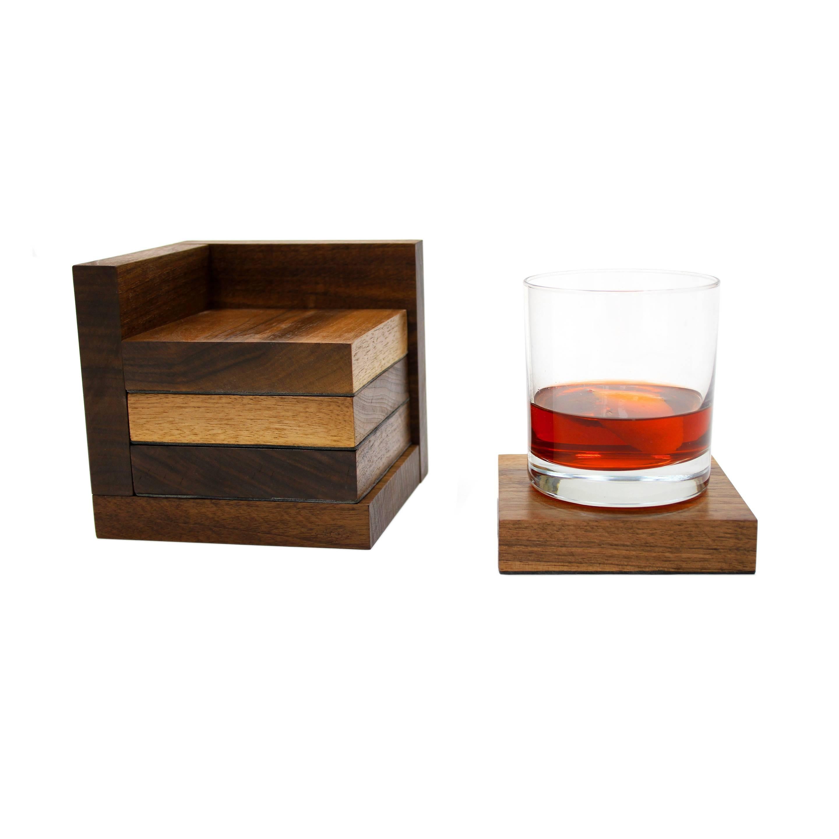 This four-piece coaster set is made from thick solid walnut that has been cut down into 4×4″ pieces and then lined with a supple lambskin. When not in use, they can be placed into the matching rack to display the wood’s dramatic end grain. Natural