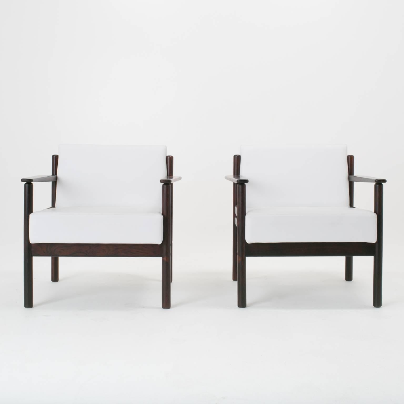 Set of simple and sleek Brazilian Rosewood armchairs. Chairs recently restored and reupholstered in a supple white leather.


Measures: The arm height is 22.00 inches
The seat depth is 22.00 inches

In order to preserve our inventory, after