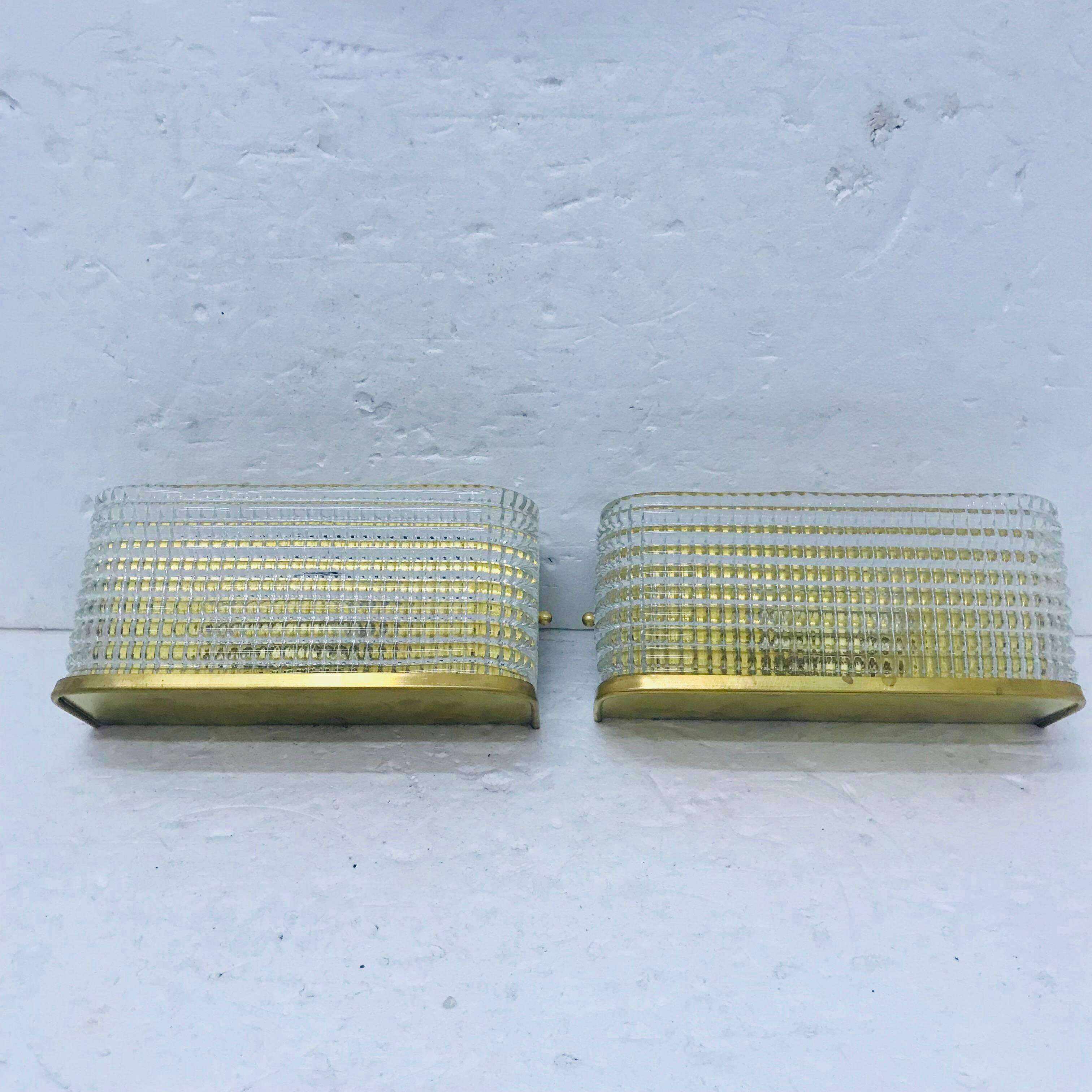 Brass and Murano glass wall sconces, made in 1970, electrical parts are fully restored. They work with both 110 and 220 Volt and need two regular e14 bulbs