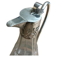 A 1900s Art Nouveau Sterling Silver and Engraved Crystal Liquor Set