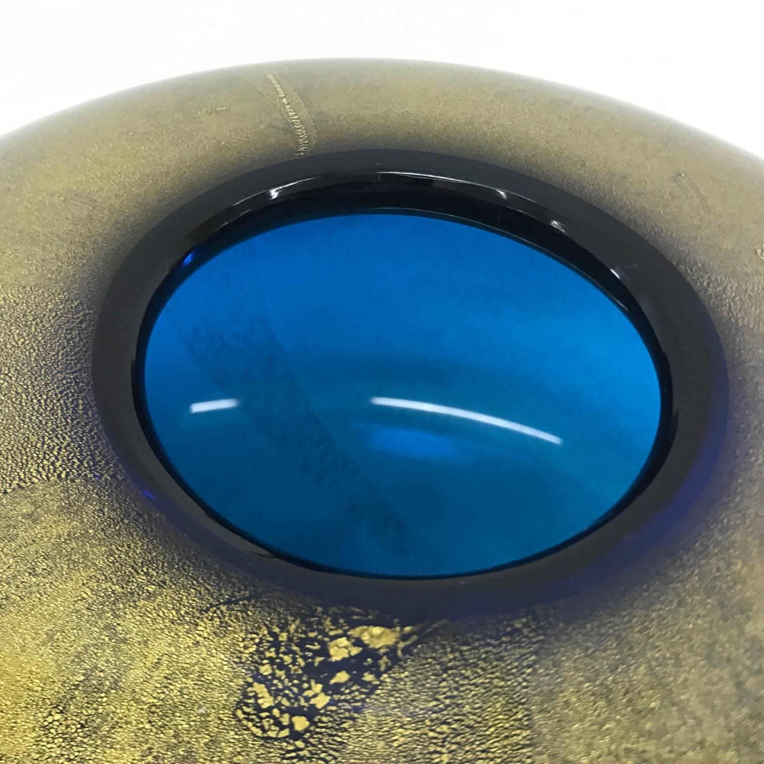 Vase from Venini, signed Laura Venini 2001, in perfect conditions, produced with a particular process and the use of gold inside the glass. The inside color is blue.