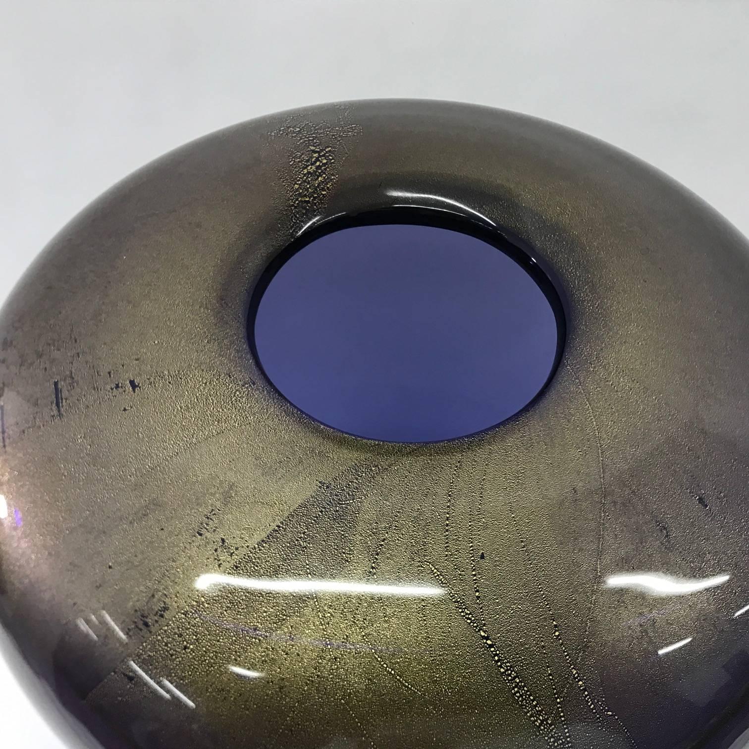 Vase from Venini, signed Laura Venini 2001, in perfect conditions, produced with a particular process and the use of pure gold inside the glass. The inside color is purple.