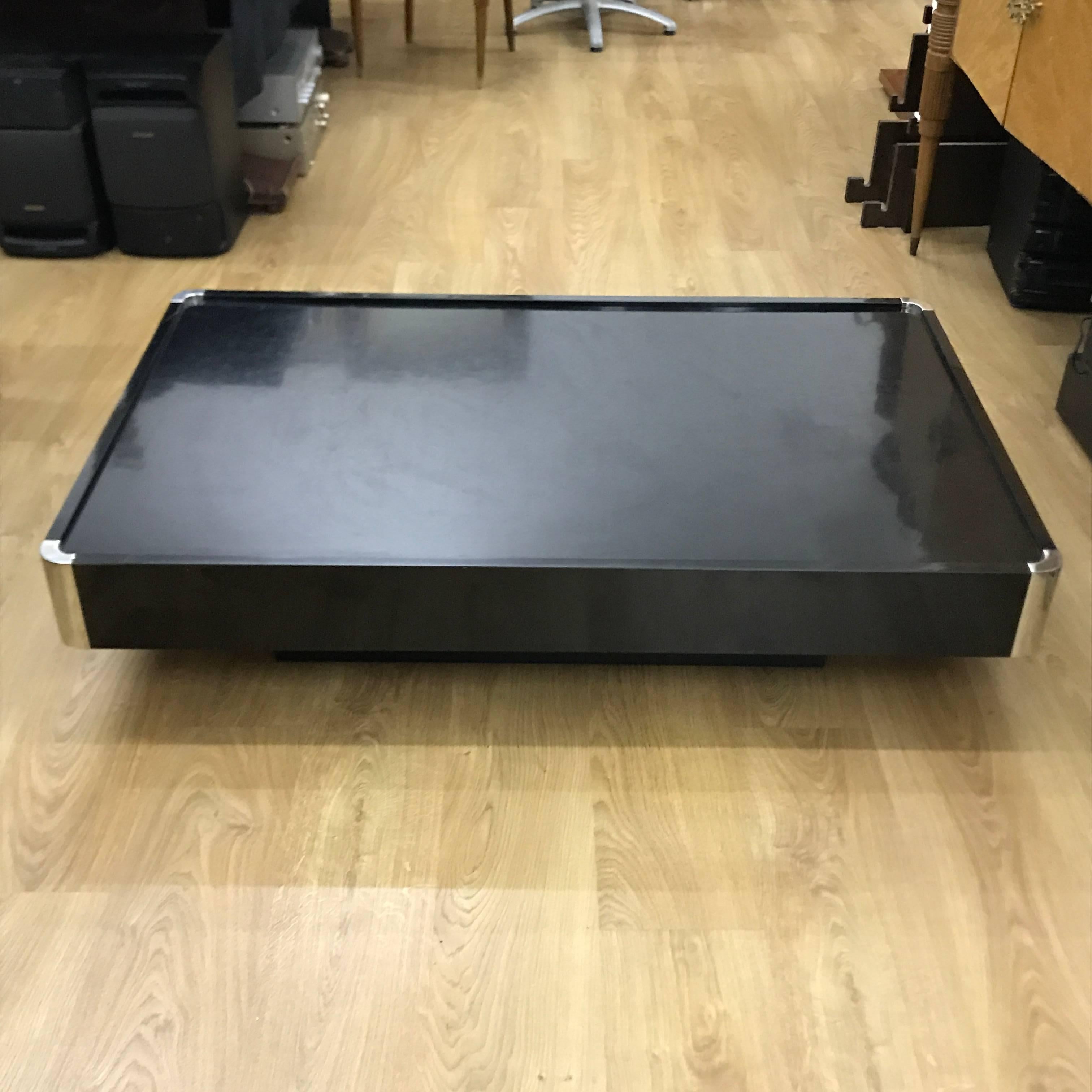 Amazing Willy Rizzo black lacquered coffee table with dished top and chrome corners, circa 1970, Signs of use and wear, shown in the photos.