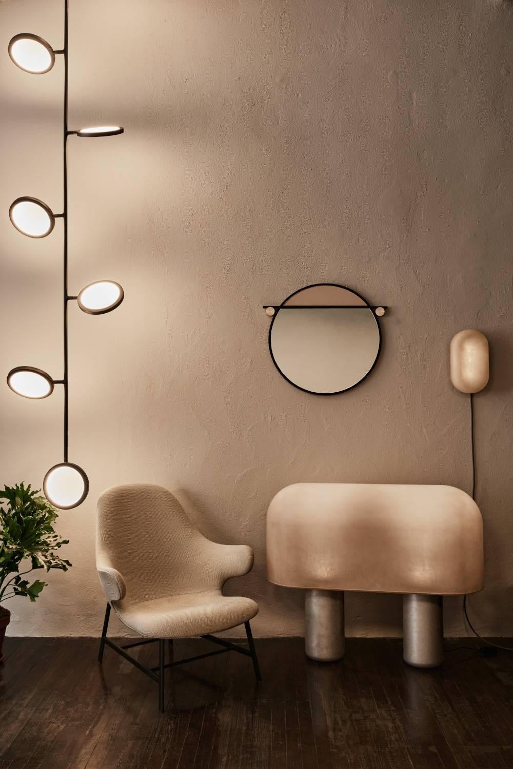 Puffball, a collection of minimal lamps, draws inspiration from the rounded caps and columned stalks of wild mushrooms and toadstools. The chunky silhouettes, made of raw fiberglass and tumbled aluminium, give off a warm luminescent glow.