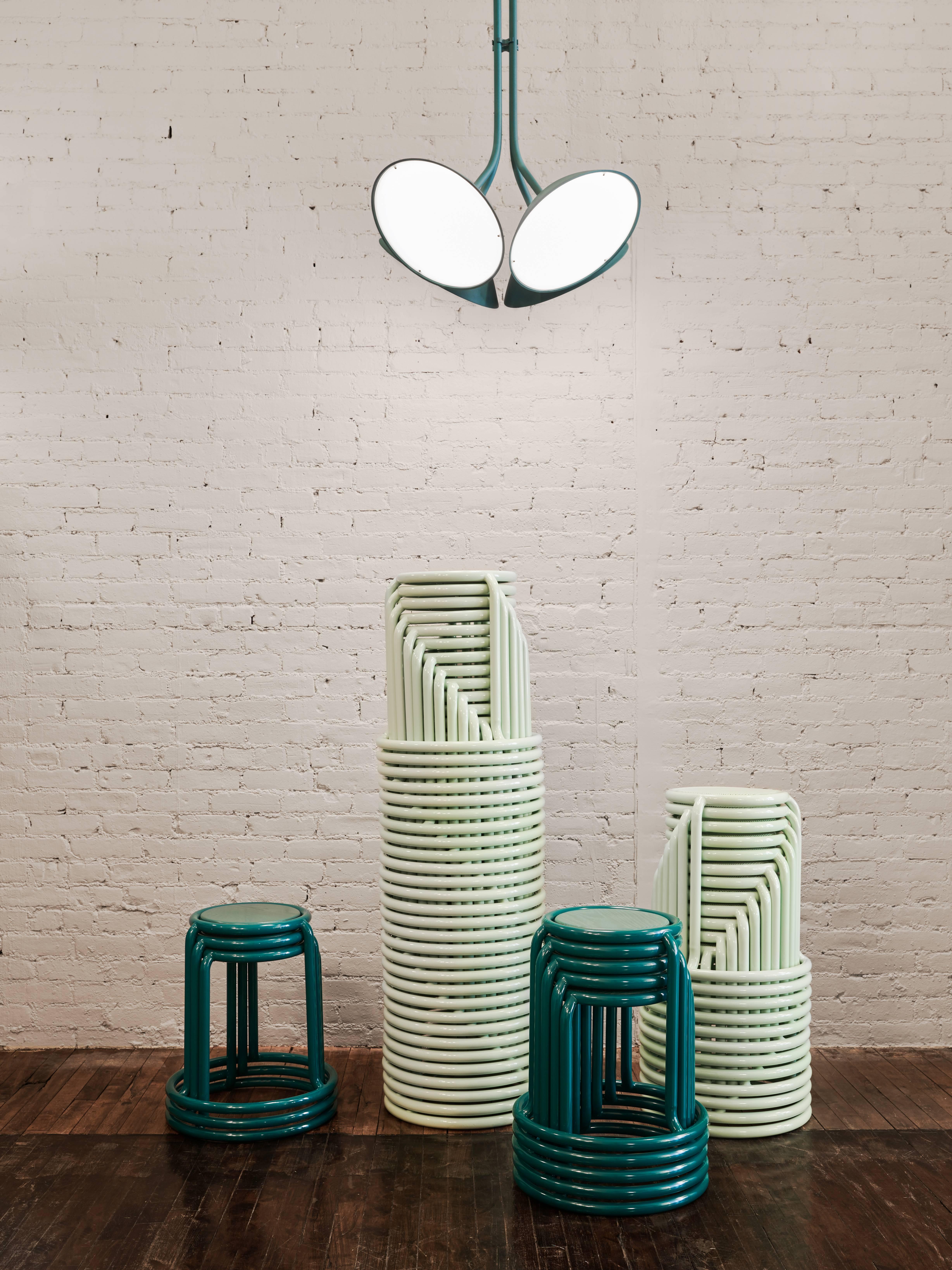 Champ is a reimagining of the utilitarian stackable stool. When stored, the stools form a graceful and graphic upward spiral. Champ provides the ideal perch for home or office and the perfect solution for larger commercial projects.