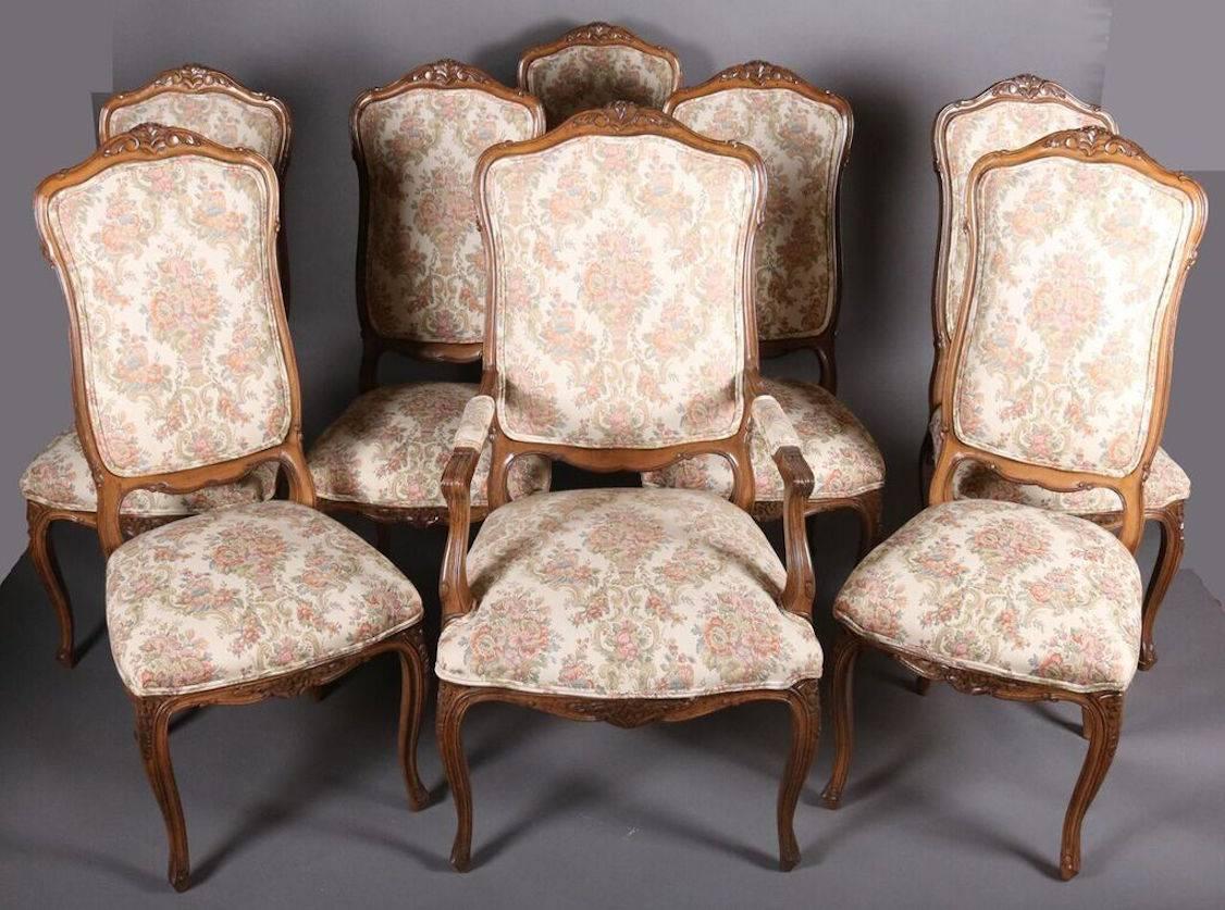 Set of 16 French Louis XV style chairs include two fauteuils (armchairs) and 14 side chairs feature walnut frame with Classic molded cartouche-shaped seat backs, cabriole legs, and more recent floral upholstery, early 20th century.
 