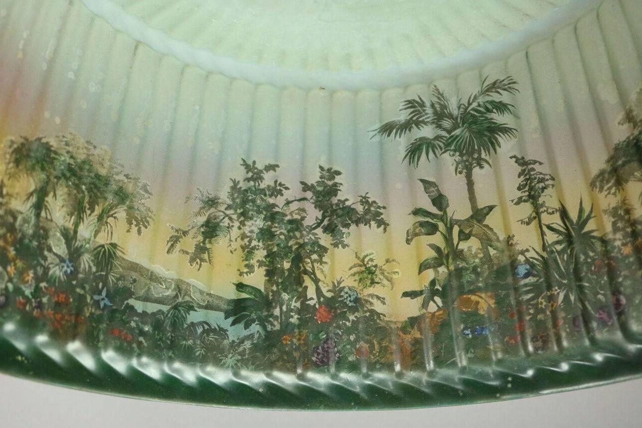 Pittsburgh lamp features reverse painted jungle scene on pleated glass shade, circa 1920.
