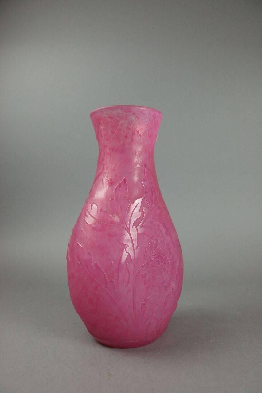 A Steuben sculptured glass vase in the Mum pattern, circa 1925, signed Frederick Carder, Corning, New York, the rose quartz vase from a line called 