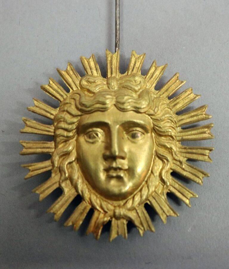 Antique picture framed giltwood Viennese-made Biedermier style grande sonnerie wall clock features gold leaf frame with oeil de boeuf molding, hammered metal decoration, engine turned face, aperture revealing sunburst pendulum, triple barrel