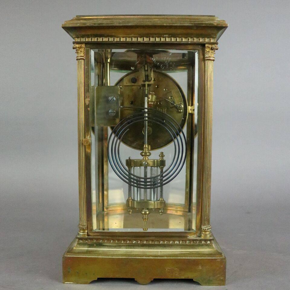 Antique French crystal regulator mantel clock by Samuel Marti features bowed front bronze frame with reeded columns encasing beveled crystal panels to include a curved glass door, enameled copper face with decorated bronze surround and works marked