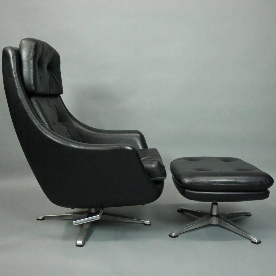Mid-Century Modern Eames style chair and matching ottoman features adjustable height shell design seat with button-back black vinyl atop swivel chrome base with matching ottoman, circa 1960.