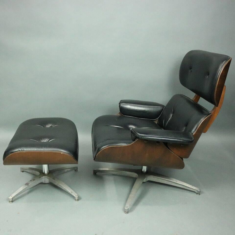 Mid-Century Modern Eames for Miller style swivel lounge chair with ottoman features molded plywood shell with black button back vinyl upholstery on a chrome swivel base with matching ottoman, circa 1960.