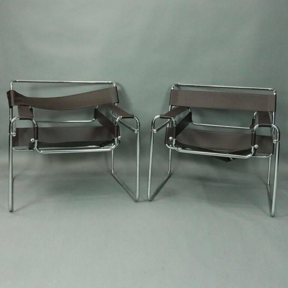 Pair of Mid-Century Modern Marcel Breuer chrome Wassily (or Model B3) chair frames. Vinyl straps in place and ready for mending or to be used as patterns for replacement straps. Chrome frames are sturdy and in very good condition, circa 1950.