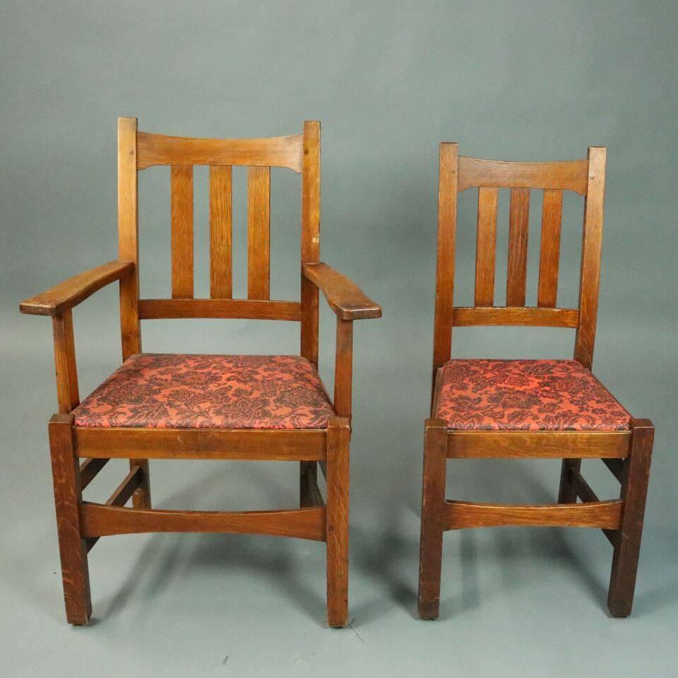 Antique set of six Stickley Brothers Arts and Crafts Mission oak dining chairs features traditional Arts & Crafts design of simple functionality. Set includes two armchairs and four side chairs, original stamp reads "Stickley Bros. Co.