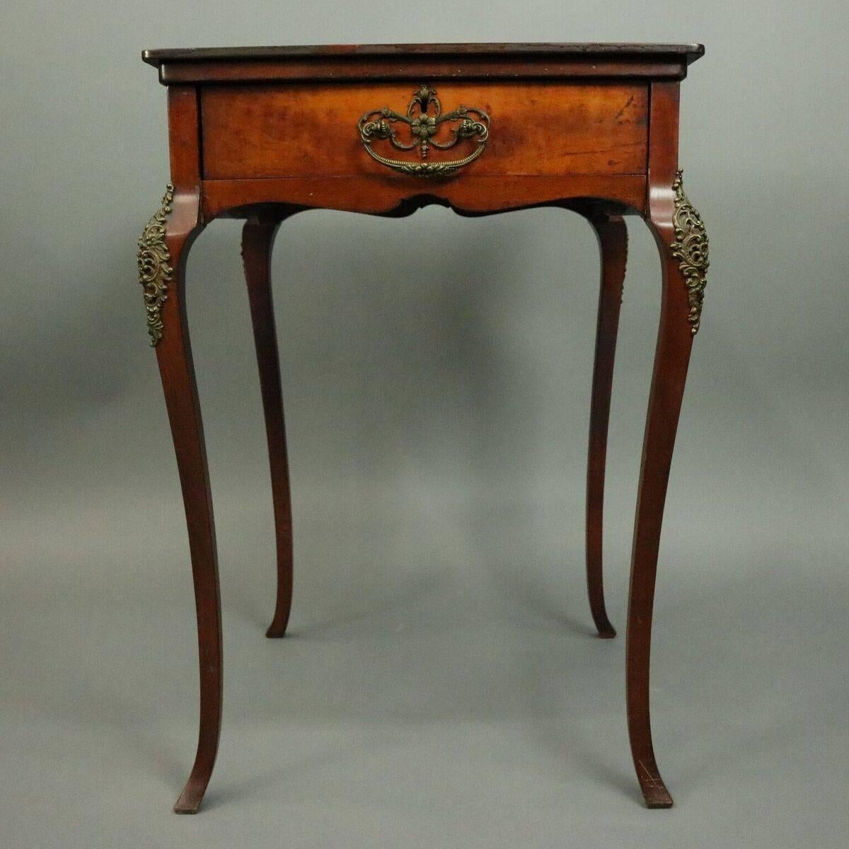 Antique French style game table features one drawer mahogany case with marble chess or checkers board insert atop cabriole legs with foliate bronze knee accoutrements, circa 1900.

Measures: 29" H x 20" x 20".