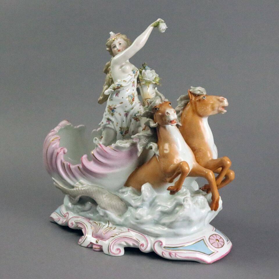 Antique German Meissen School, possibly Schierholz, hand painted porcelain figural group depicting sea nymph on her horse drawn shell-shaped carriage, circa 1880.

Measures - 11" H x 10" W x 5" D.
