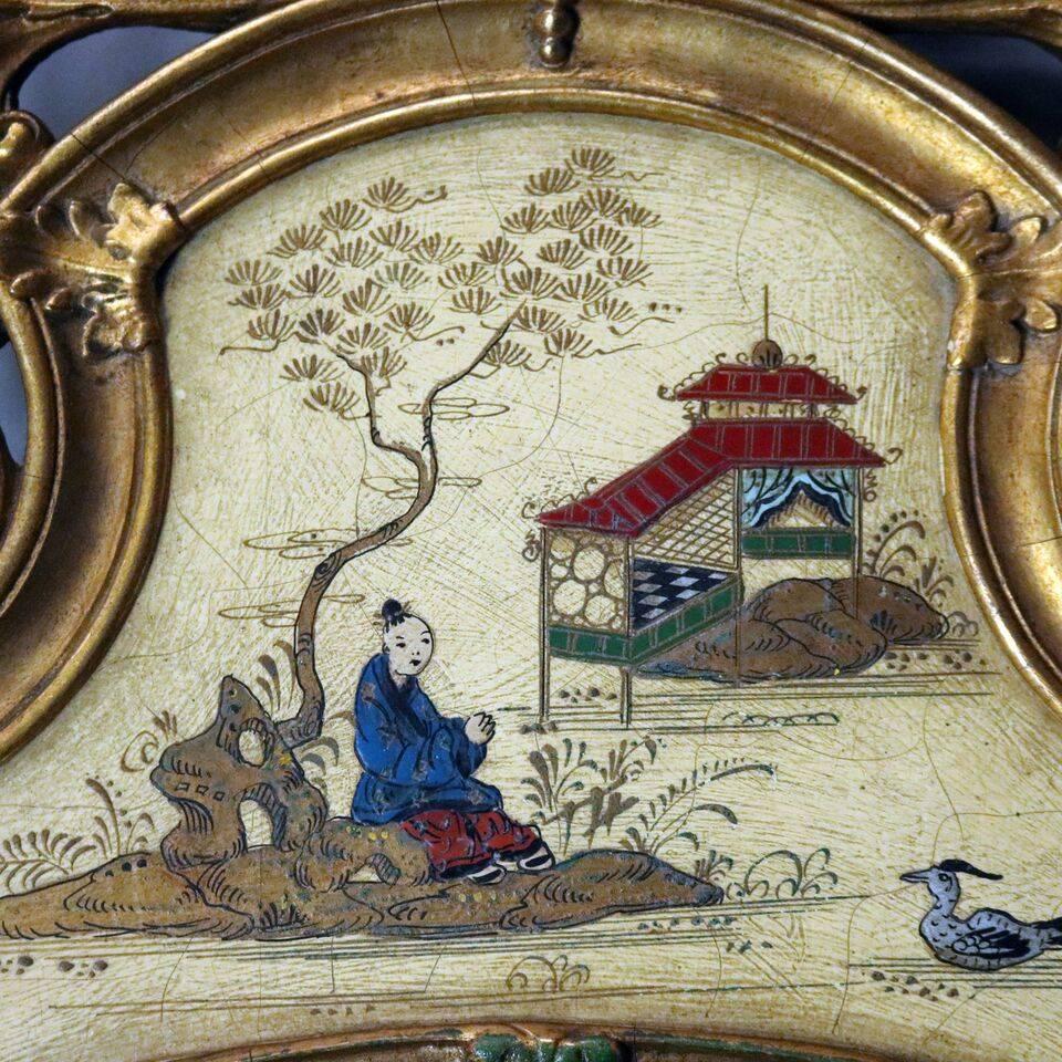Vintage chinoiserie hand-painted wall mirror features pediment with lake scene topped by a palmette and foliate gilt crest, surround decorated with figures and floral spray highlighted all around in gold, circa 1940

Measures: 47.5" H x