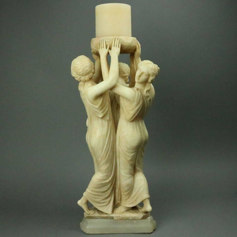 Antique Italian neoclassical carved alabaster figural sculpture depicting the Three Graces raising a central basket inspired by the original Greek Sculpture by Antonio Canova, circa 1880

Measures: 21.25" height x 11" diameter


The