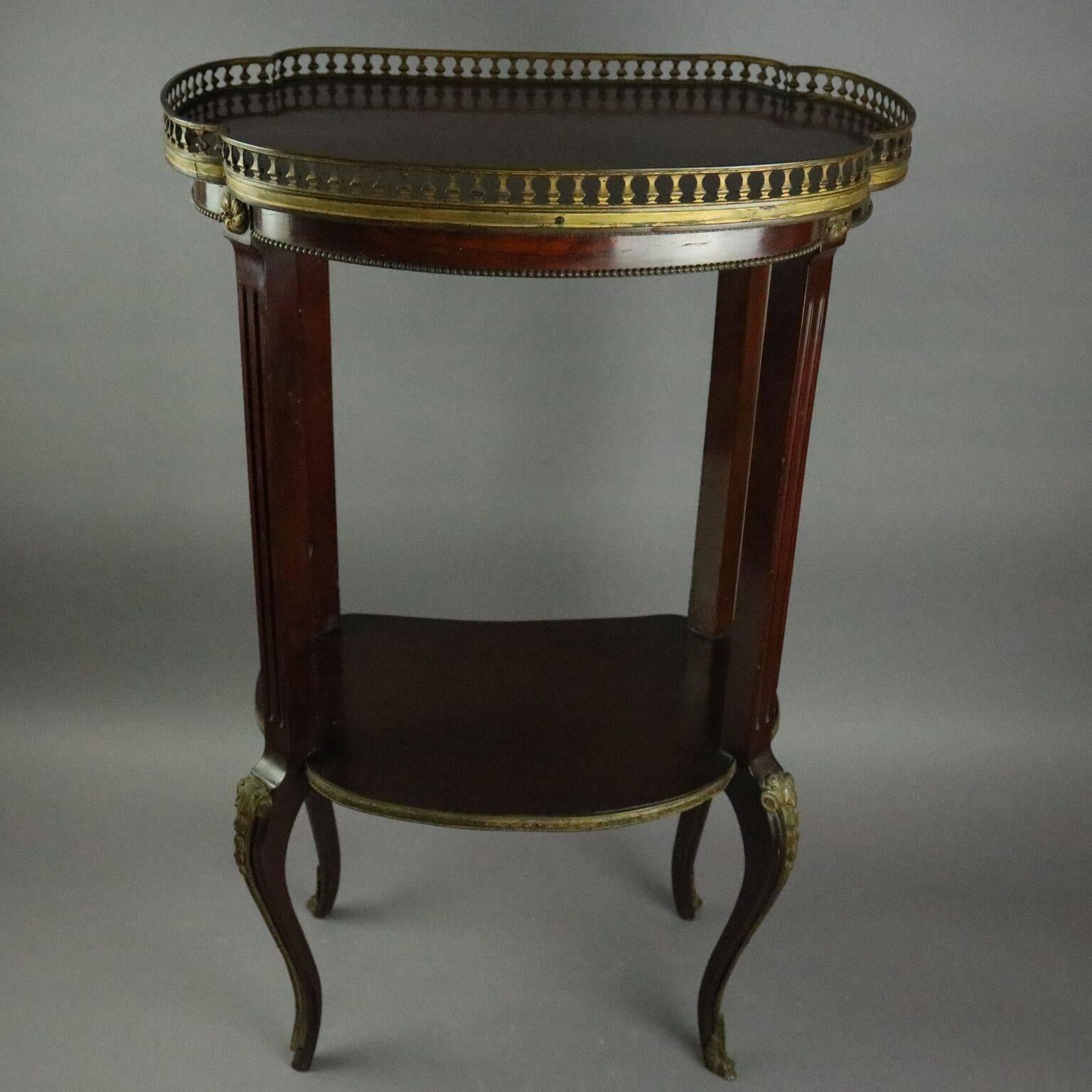 Antique French Louis XIV style sculpture stand features mahogany construction with bowed front and sides, open central gallery, reeded supports terminating in cabriole legs, bonze accoutrements include pierced gallery, rosettes, acanthus on knees
