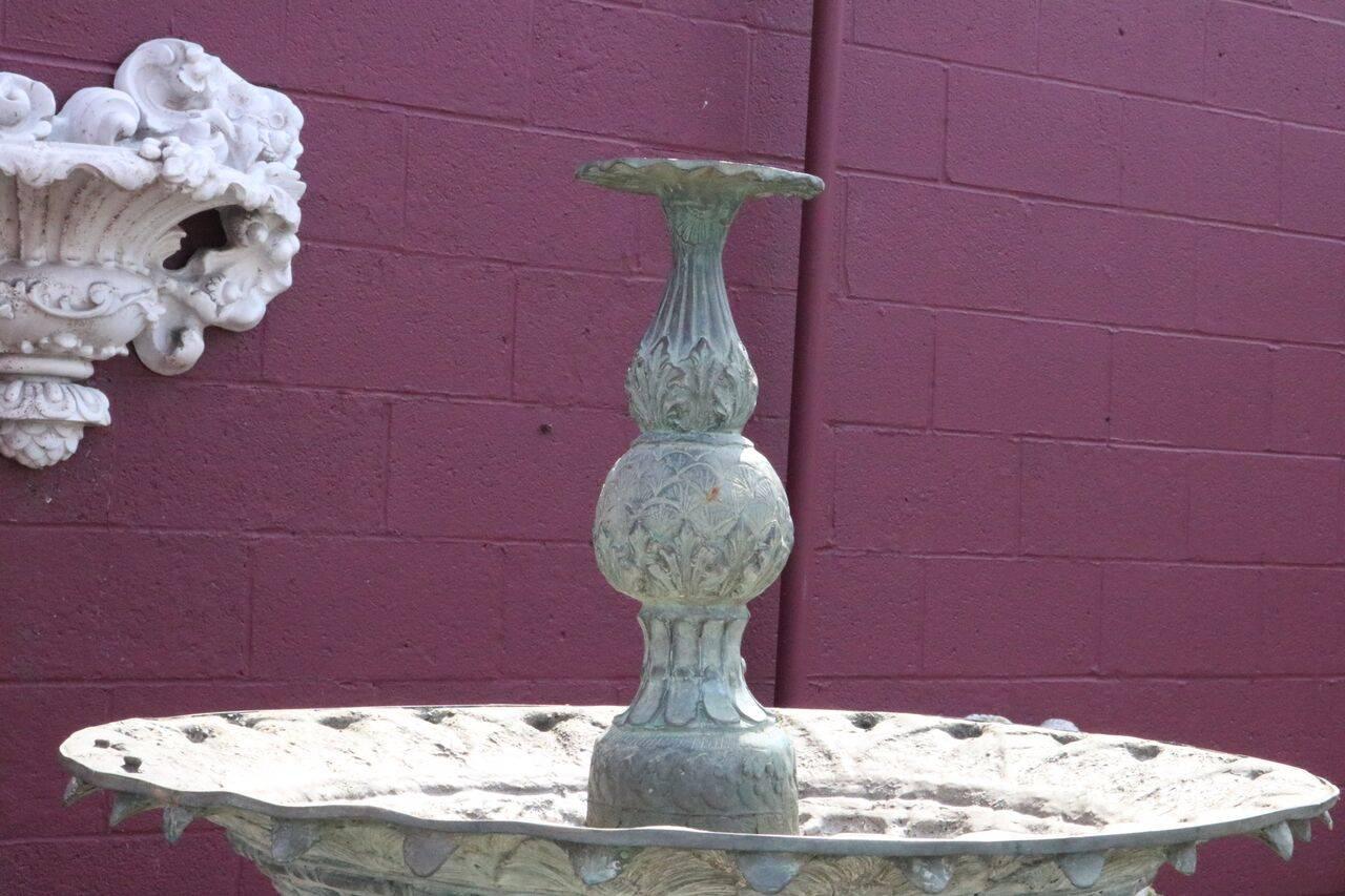 Vintage figural bronze Baroque style two-tier garden fountain with stacked bowls decorated with cherubim and dolphin, nice verdigris finish, circa 1930.

Measures: 84" H x 49" diameter.