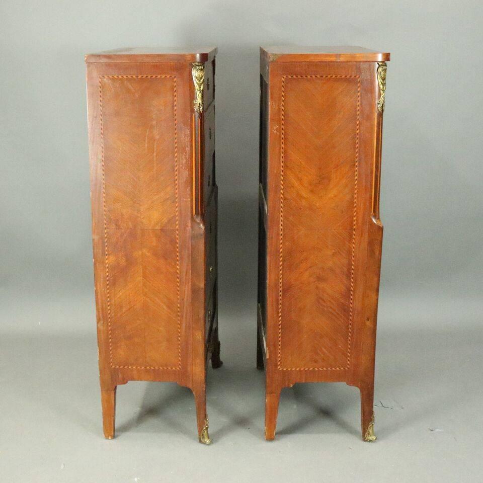 Antique pair of French six-drawer lingerie chests feature satinwood inlaid banded kingwood construction with bronze escutcheons and accoutrements, en verso "Made in France" branded stamp, circa 1920

Measure: 50" H x 24" W x
