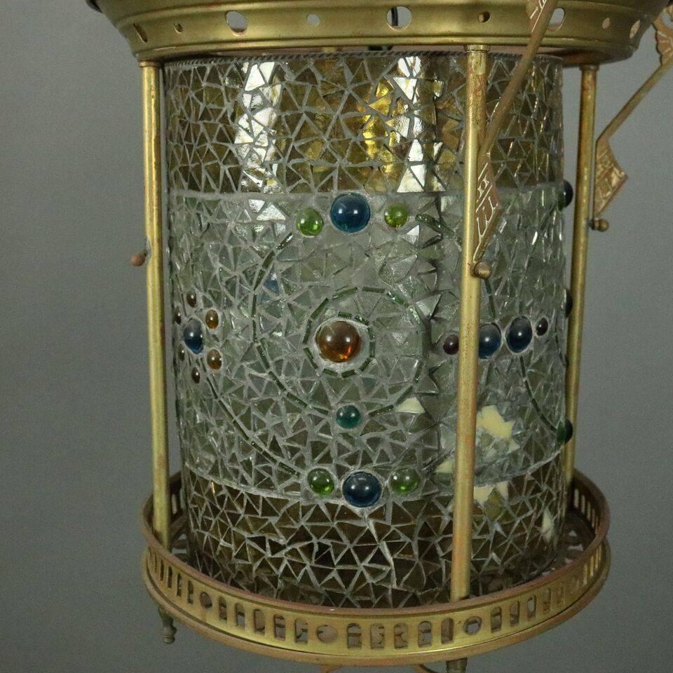 Antique Aesthetic Movement hanging hall light by Belcher Studios features cylindrical mosaic leaded glass shade in primarily clear and gold glass with floral and scrollwork accented by colored nuggets, housed in a pierced bronze frame suspended by