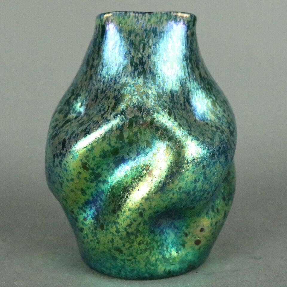 Antique Loetz art glass vase features pinched form with blue green oil spot finish, unsigned, circa 1920

Measures: 4.5