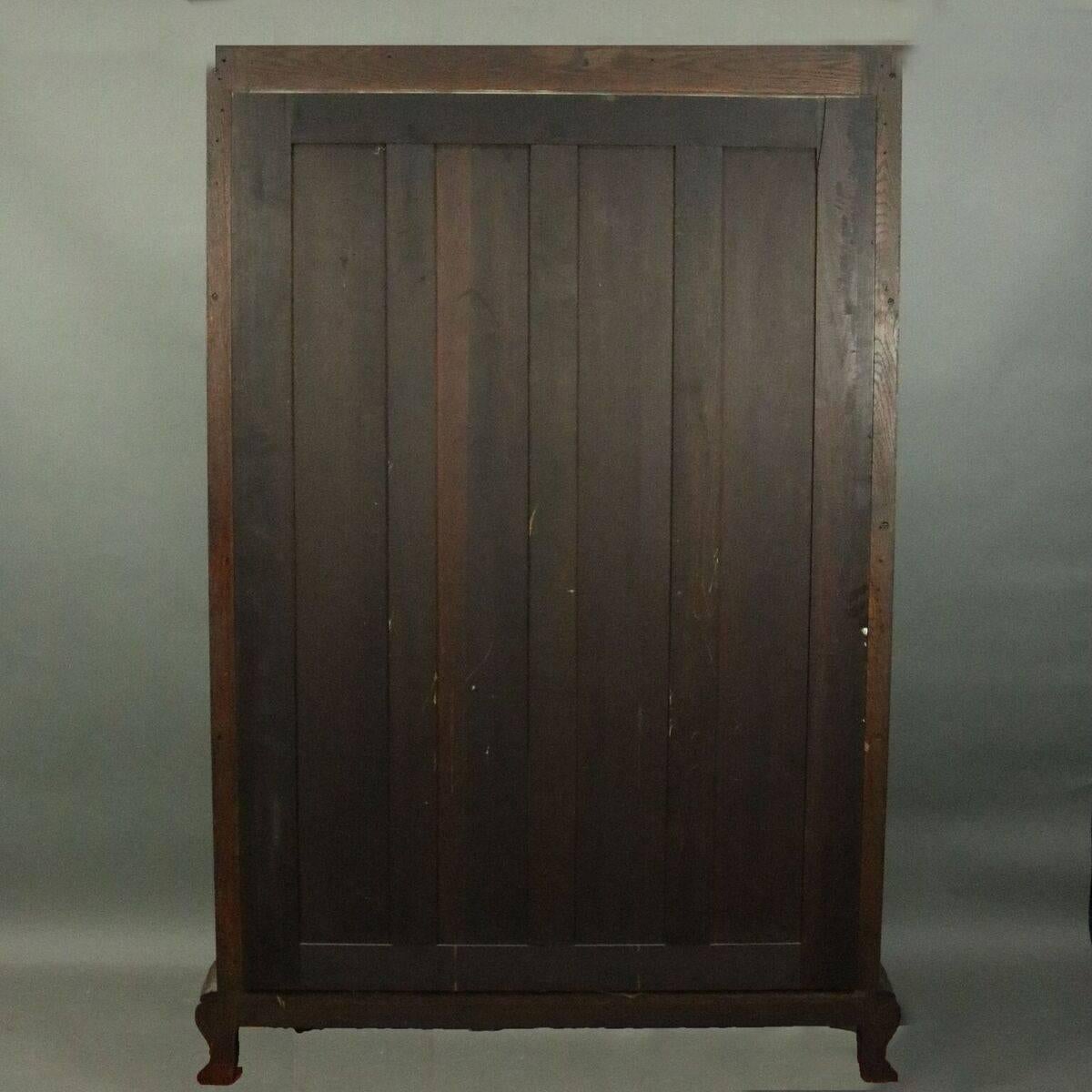 American R.J. Horner Bros. Figural Carved Oak Mirror Back China Cabinet, circa 1890